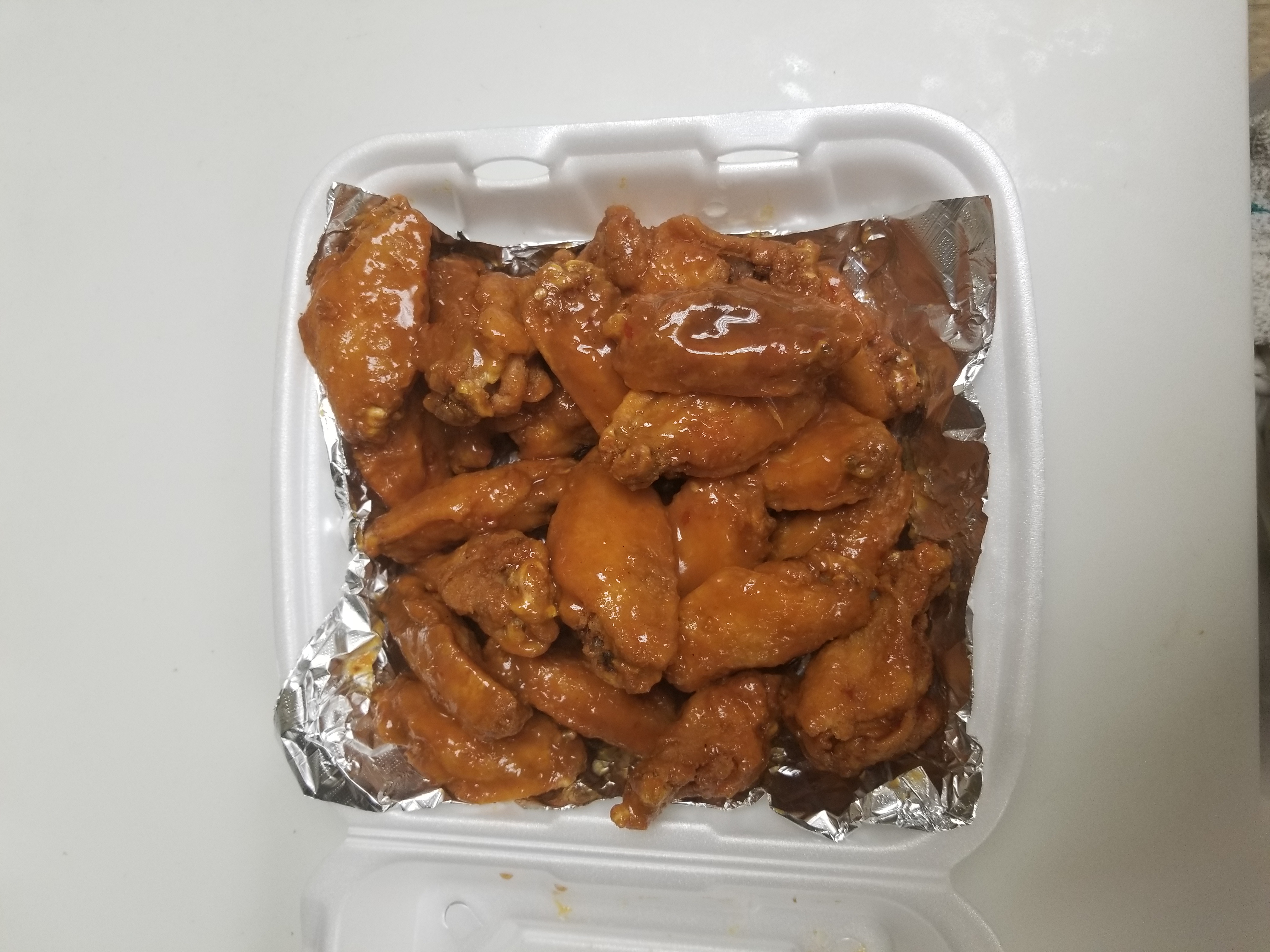 Order 24 Pieces Wings food online from H & A Deli store, Rochester on bringmethat.com
