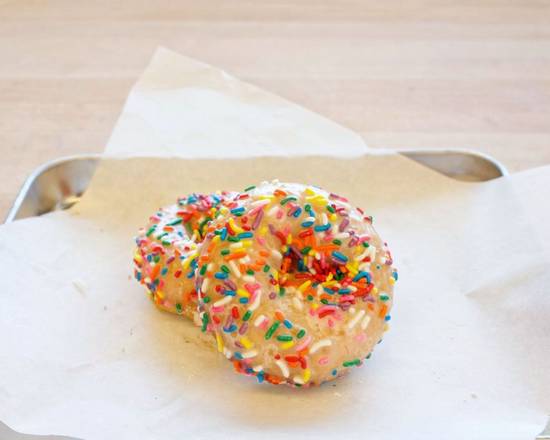 Order Vanilla Cake with Rainbow Sprinkles food online from Baked N Denver store, Denver on bringmethat.com
