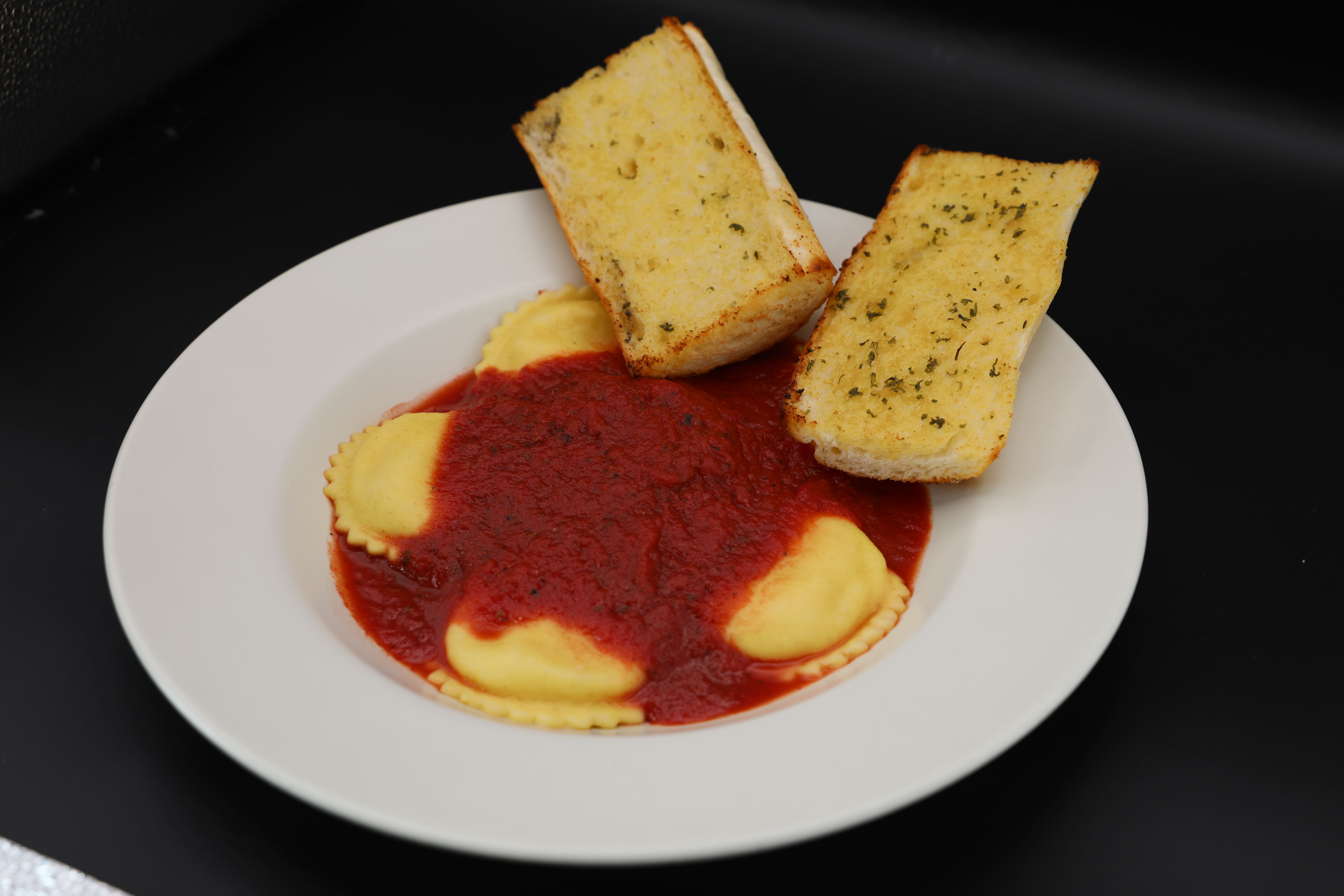 Order Ravioli with Meat Sauce food online from Giovanni's store, Carpinteria on bringmethat.com