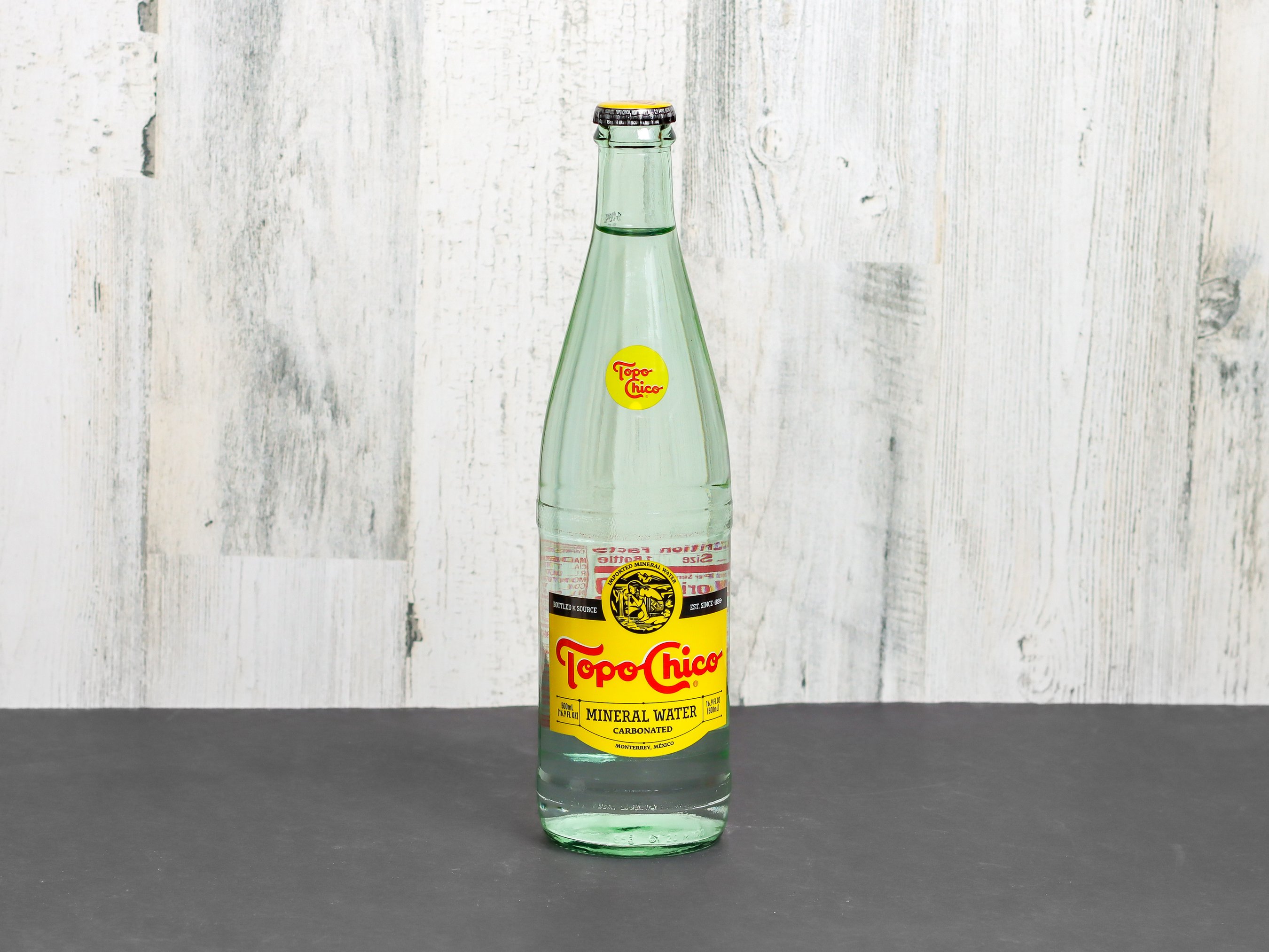Order 16 oz. Topo Chico Agua Mineral food online from Greenville Stop store, Dallas on bringmethat.com