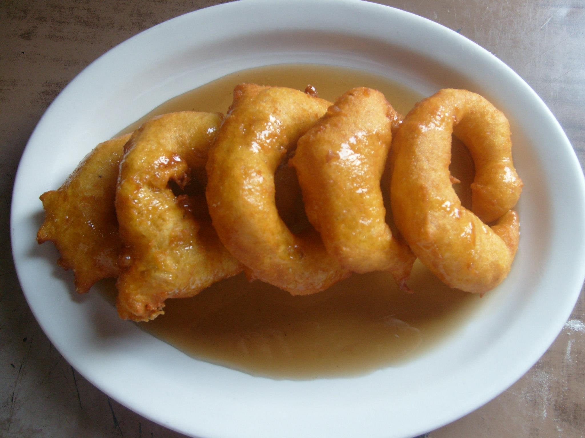 Order 81. Picarones food online from Mily & Lalo Peruvian Restaurant store, Charlotte on bringmethat.com