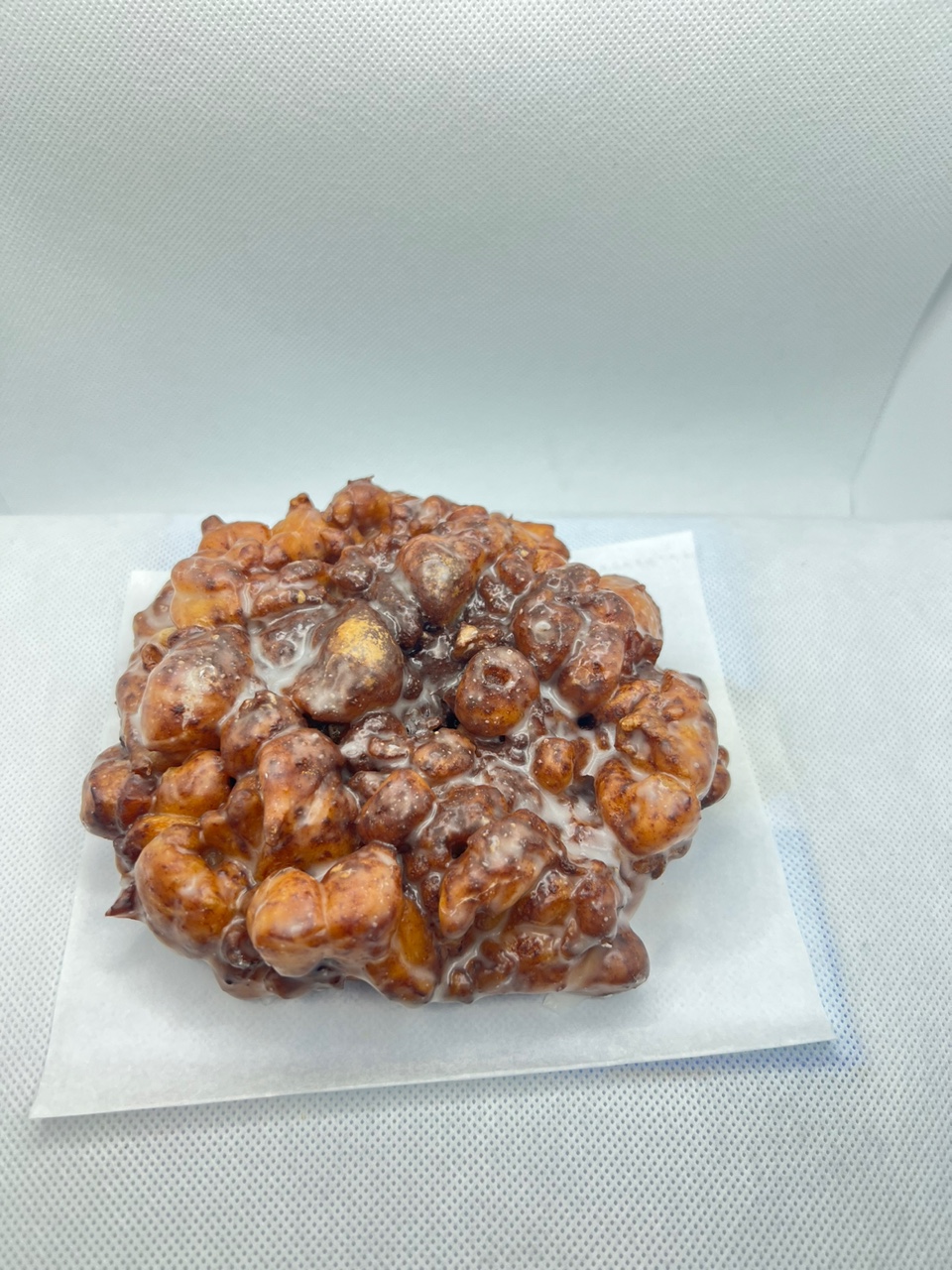 Order Apple Fritter Donuts food online from Fresh & Creamy Donuts store, Lewisville on bringmethat.com