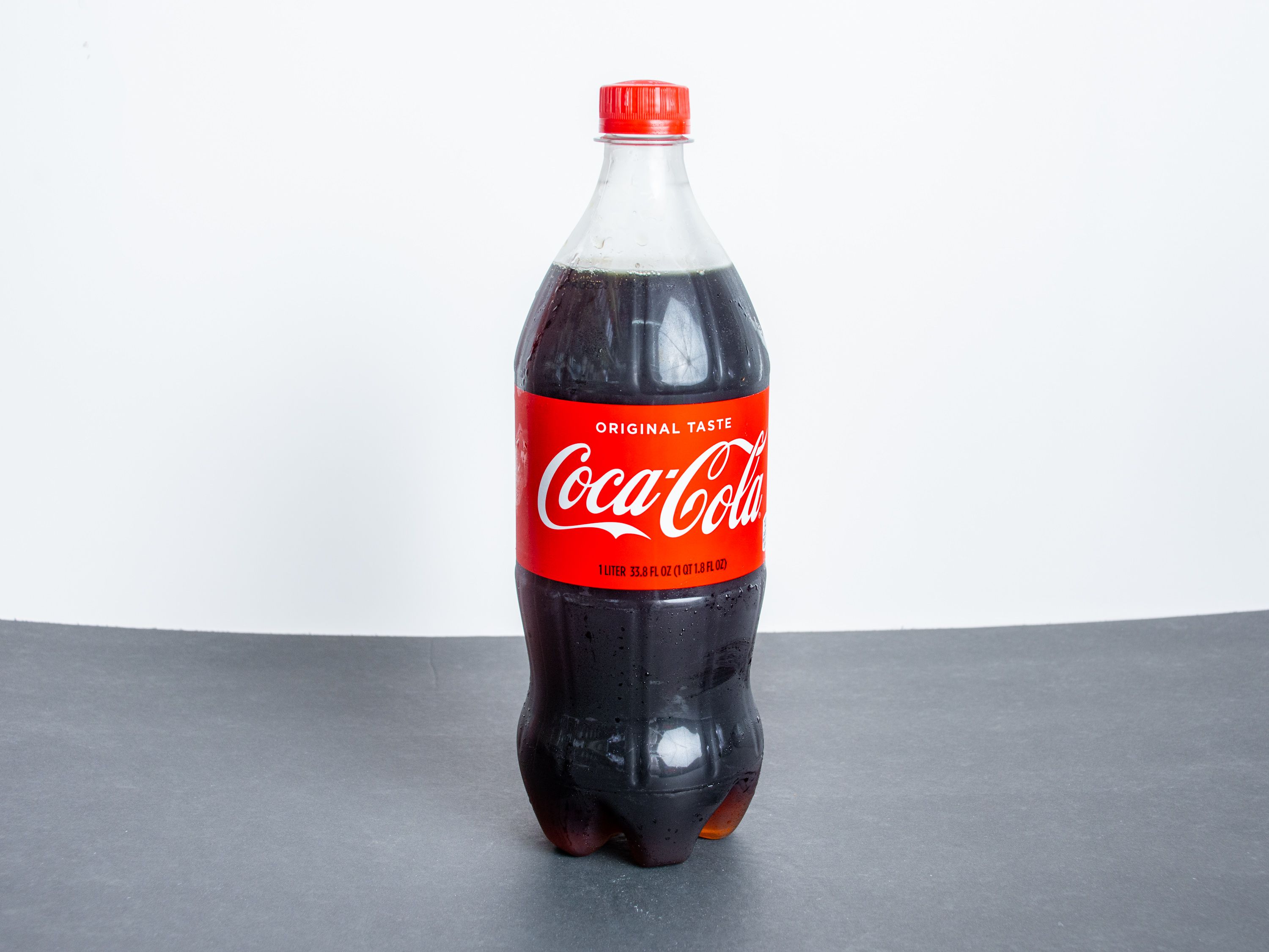 Order 2 Liter Coke Cola food online from J St Liquor store, Chula Vista on bringmethat.com