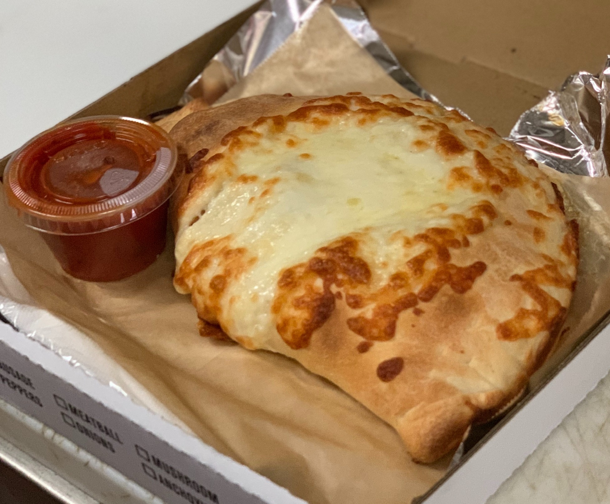 Order Three Cheese Calzone food online from Boston Pizza store, Las Vegas on bringmethat.com