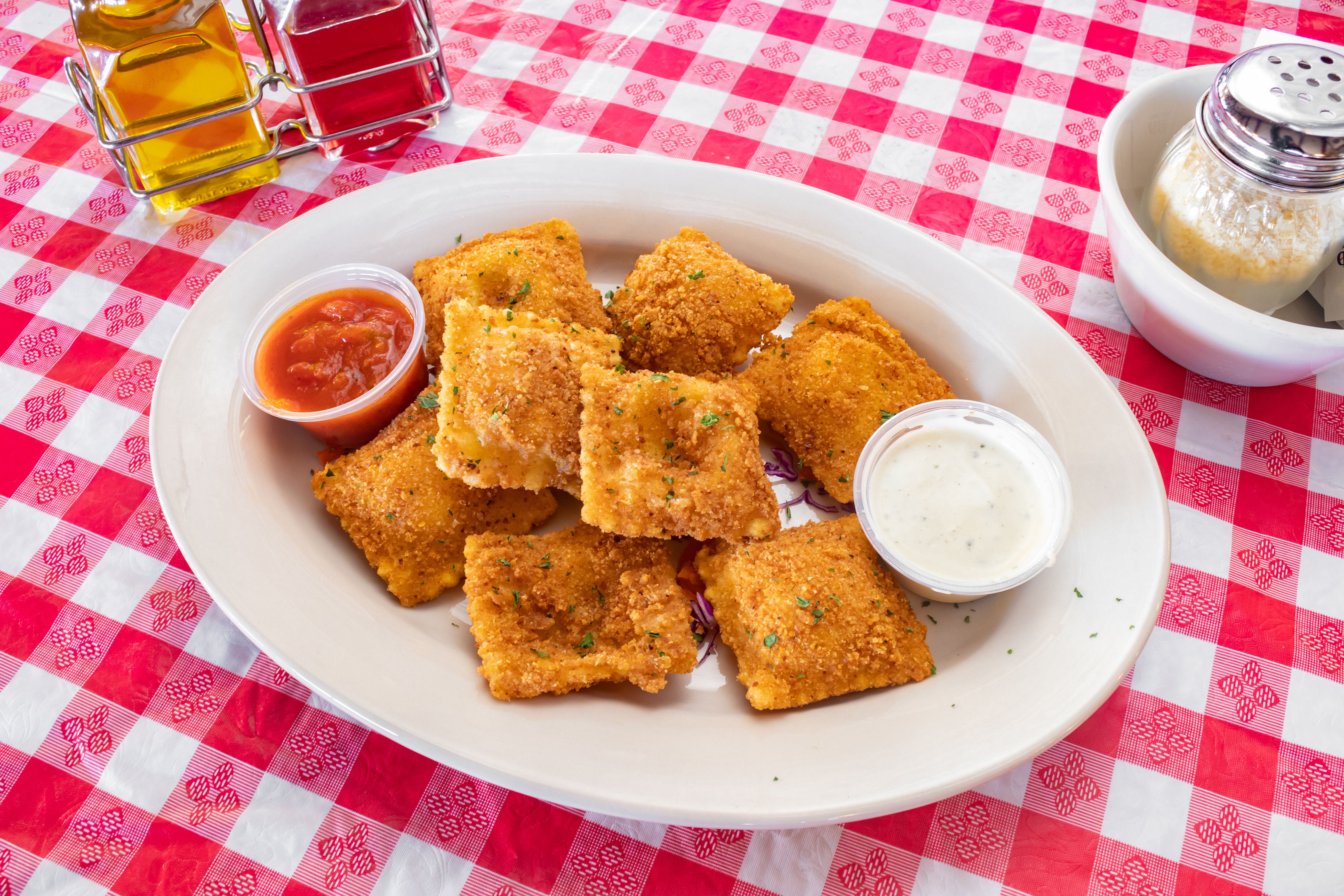 Order Toasted Cheese Ravioli - 10 Pieces food online from North Beach Pizza Inc store, San Francisco on bringmethat.com