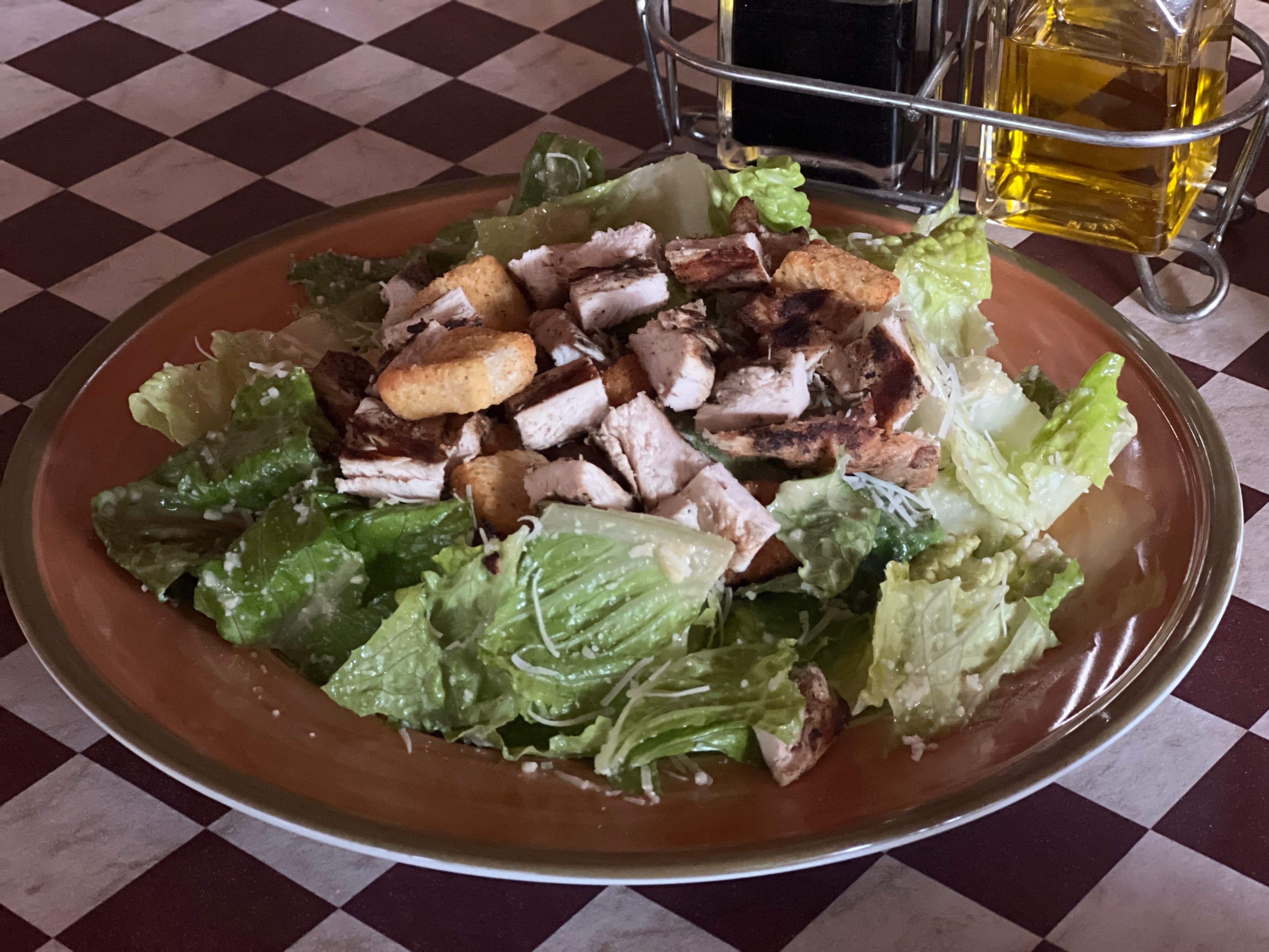 Order Caesar Salad With Marinated Broiled Chicken Breast - Salad food online from Village Pizza Restaurant store, Orinda on bringmethat.com