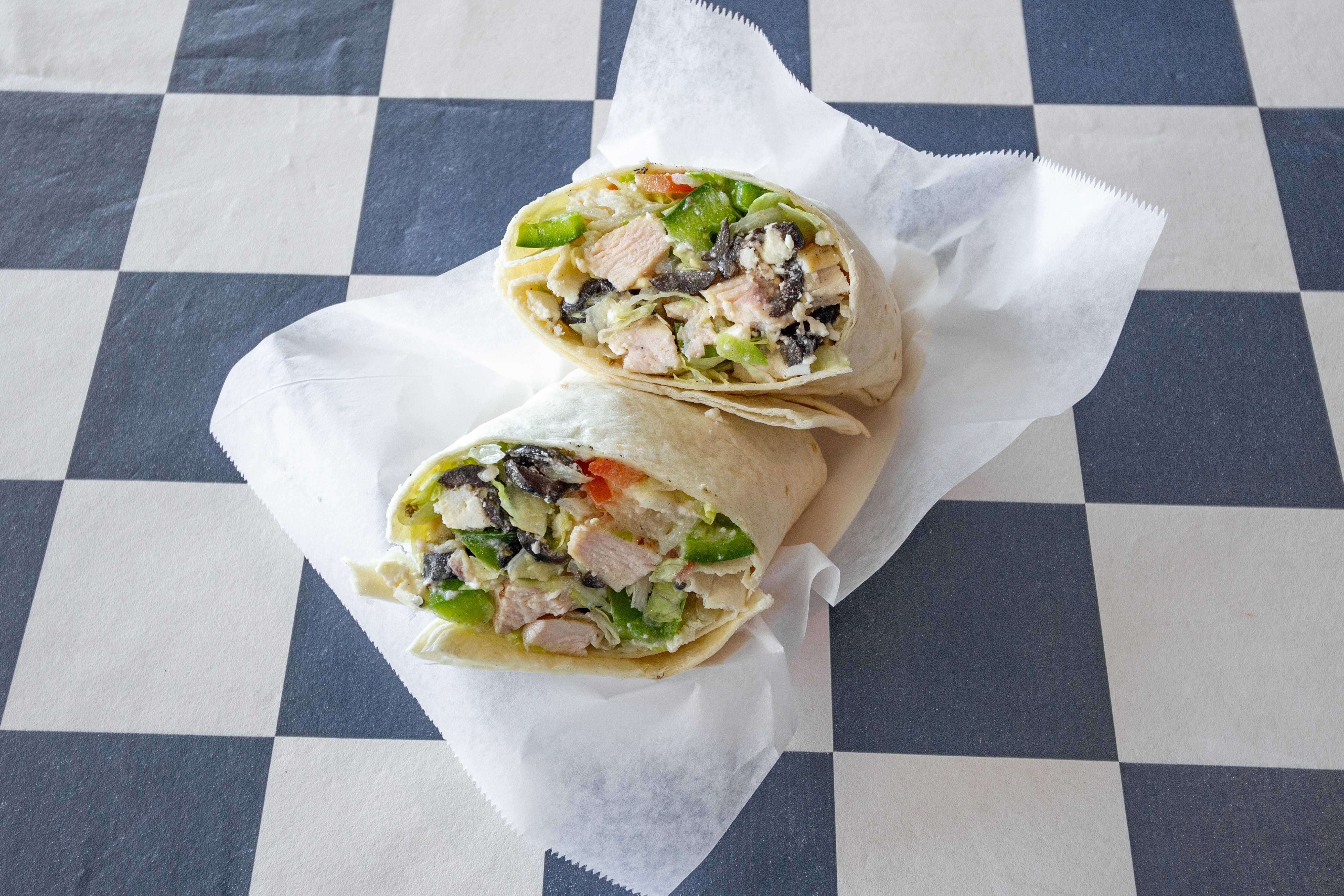 Order Grilled Chicken Greek Wrap - Wrap food online from Pizza Works store, Williamsville on bringmethat.com