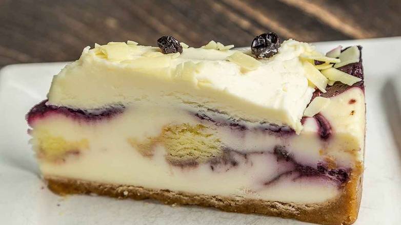 Order Blueberry Cobbler White Chocolate Cheesecake food online from Wings & Things store, Orem on bringmethat.com