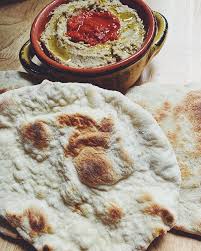 Order Naan Bread with Hummus and Guacamole food online from Fathead Steve store, La Crosse on bringmethat.com