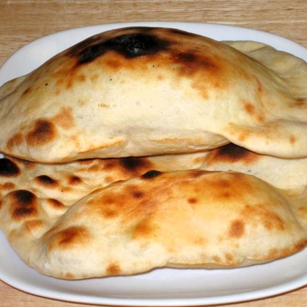 Order Naan food online from Agra Cafe store, Los Angeles on bringmethat.com