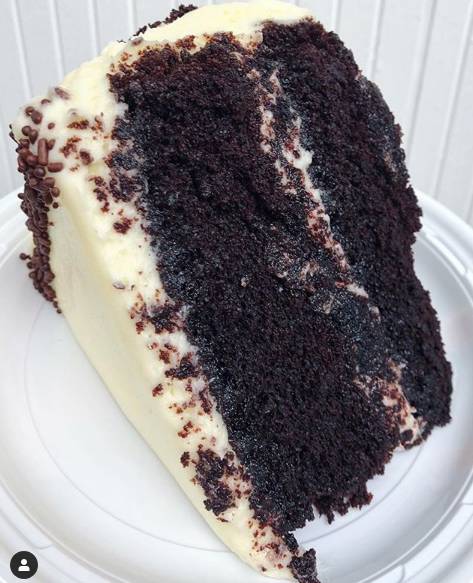 Order Chocolate Cake with Vanilla Buttercream Slice food online from Buttercup Bake Shop store, New York on bringmethat.com