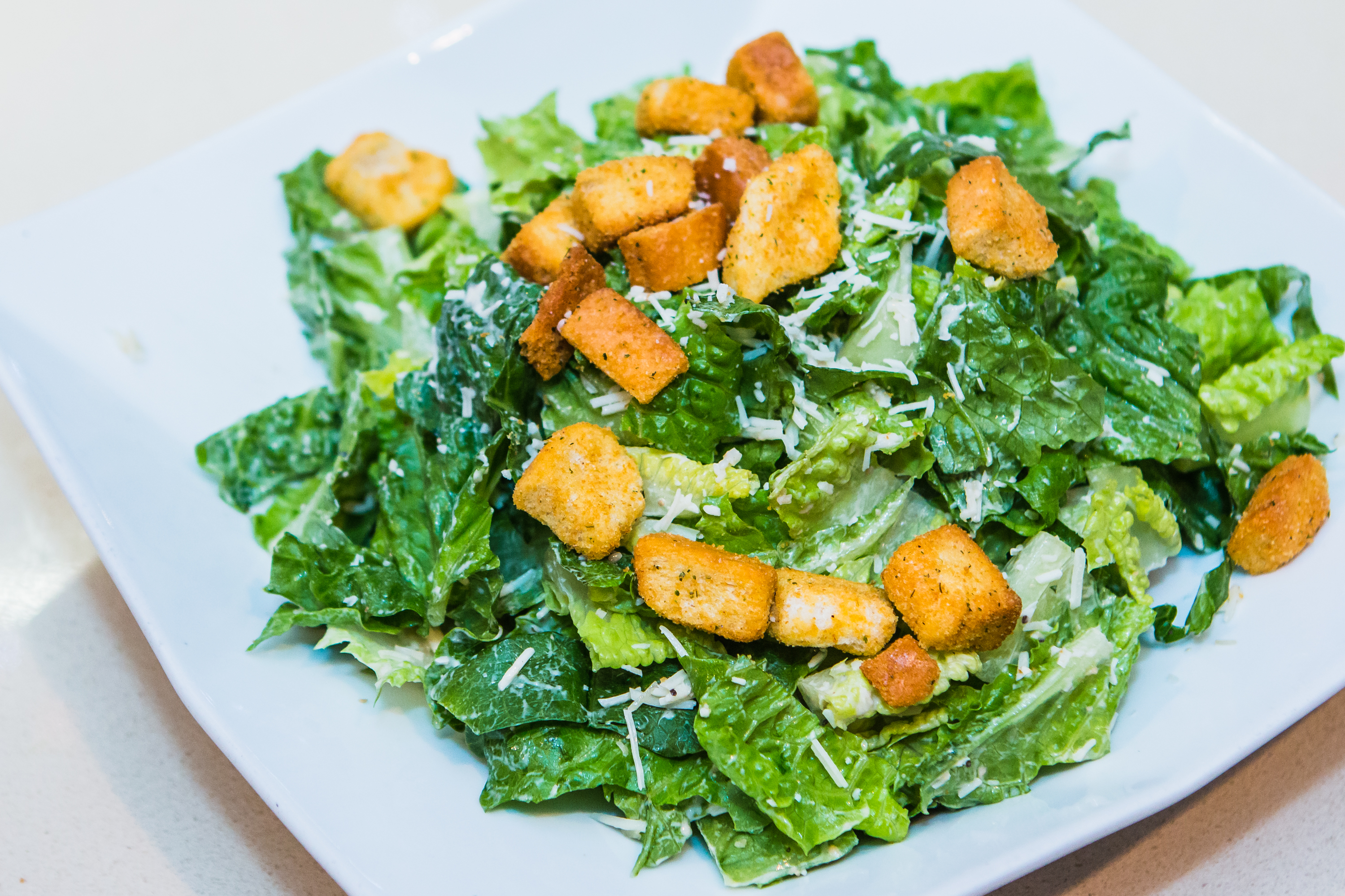 Order Caesar Salad food online from Panini Pizza & Italian Kitchen store, West Hollywood on bringmethat.com