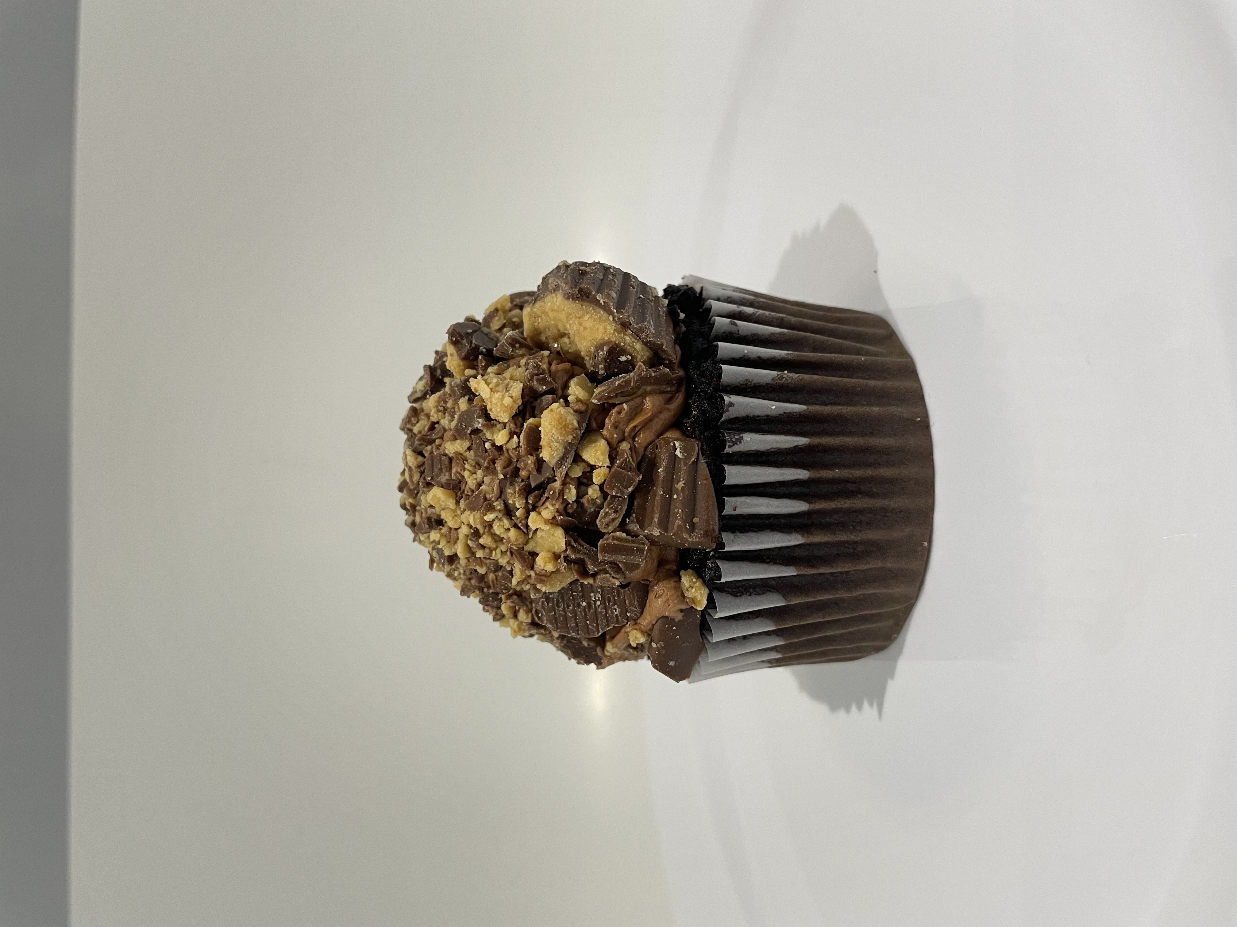 Order Peanut Butter Cup Cupcake food online from The House of Cupcakes store, Princeton on bringmethat.com