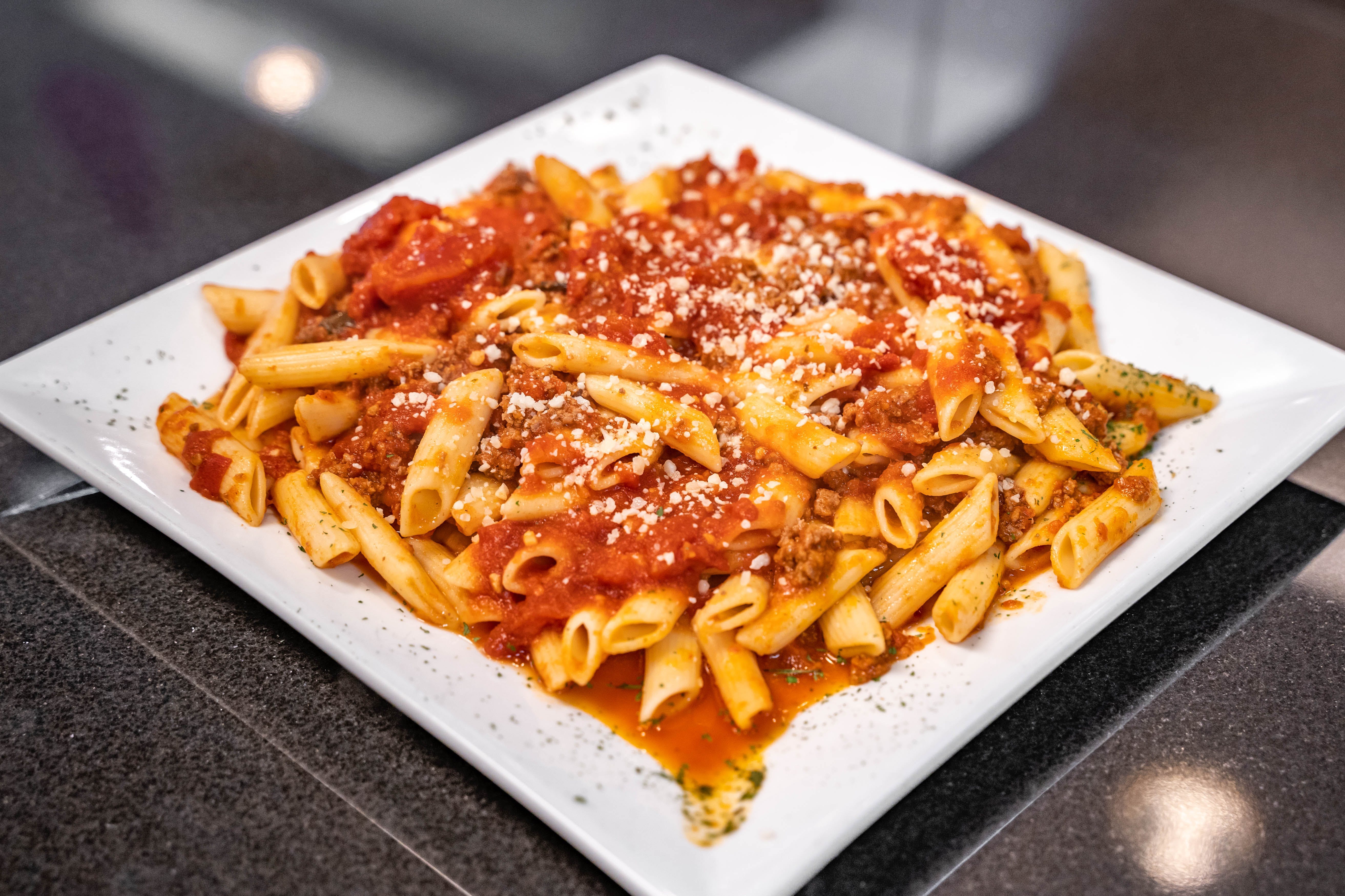 Order Penne Bolognese - Entree food online from Father & Sons store, Woodbury on bringmethat.com