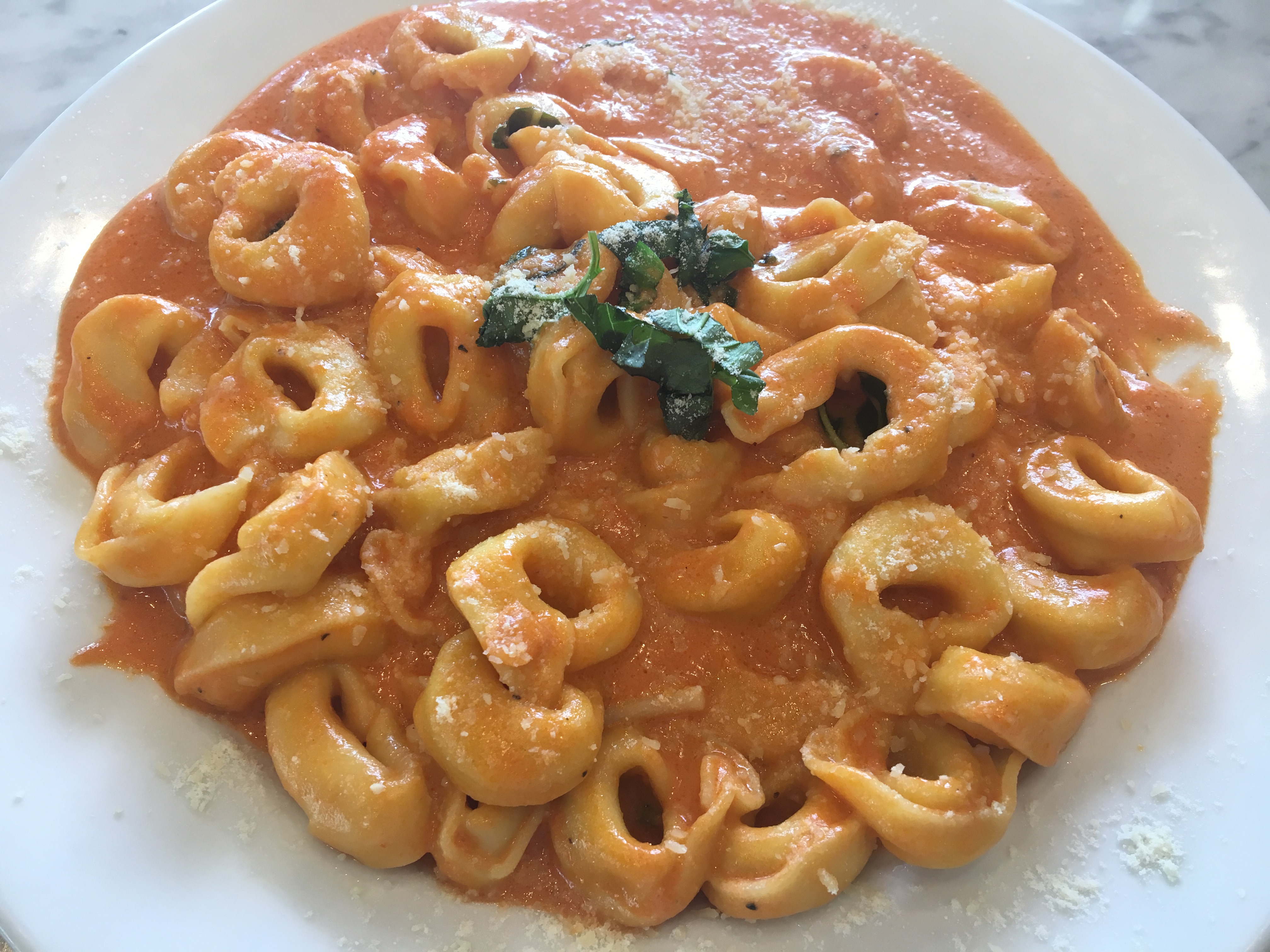 Order Tortellini Pink Sauce food online from Tonino's Place Pizzeria store, Woodland Hills on bringmethat.com