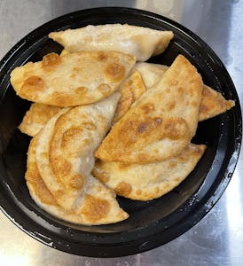 Order Fried or steamed Pork Dumplings (10) food online from Asian Taste - Belair Rd store, Baltimore on bringmethat.com