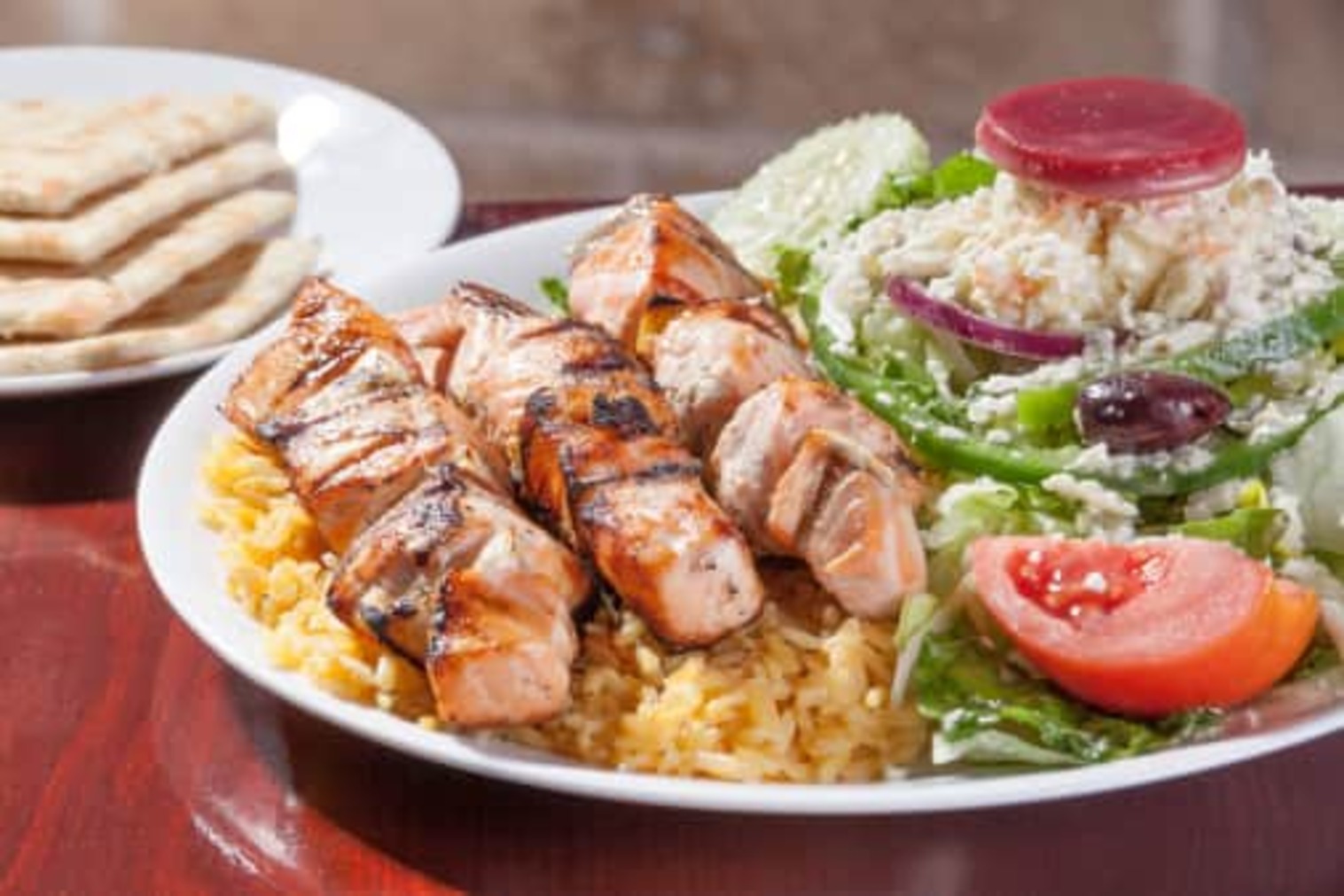 Order Salmon Skewers with Rice & Greek Salad Dinner food online from Little Greek Fresh Grill store, Youngstown on bringmethat.com