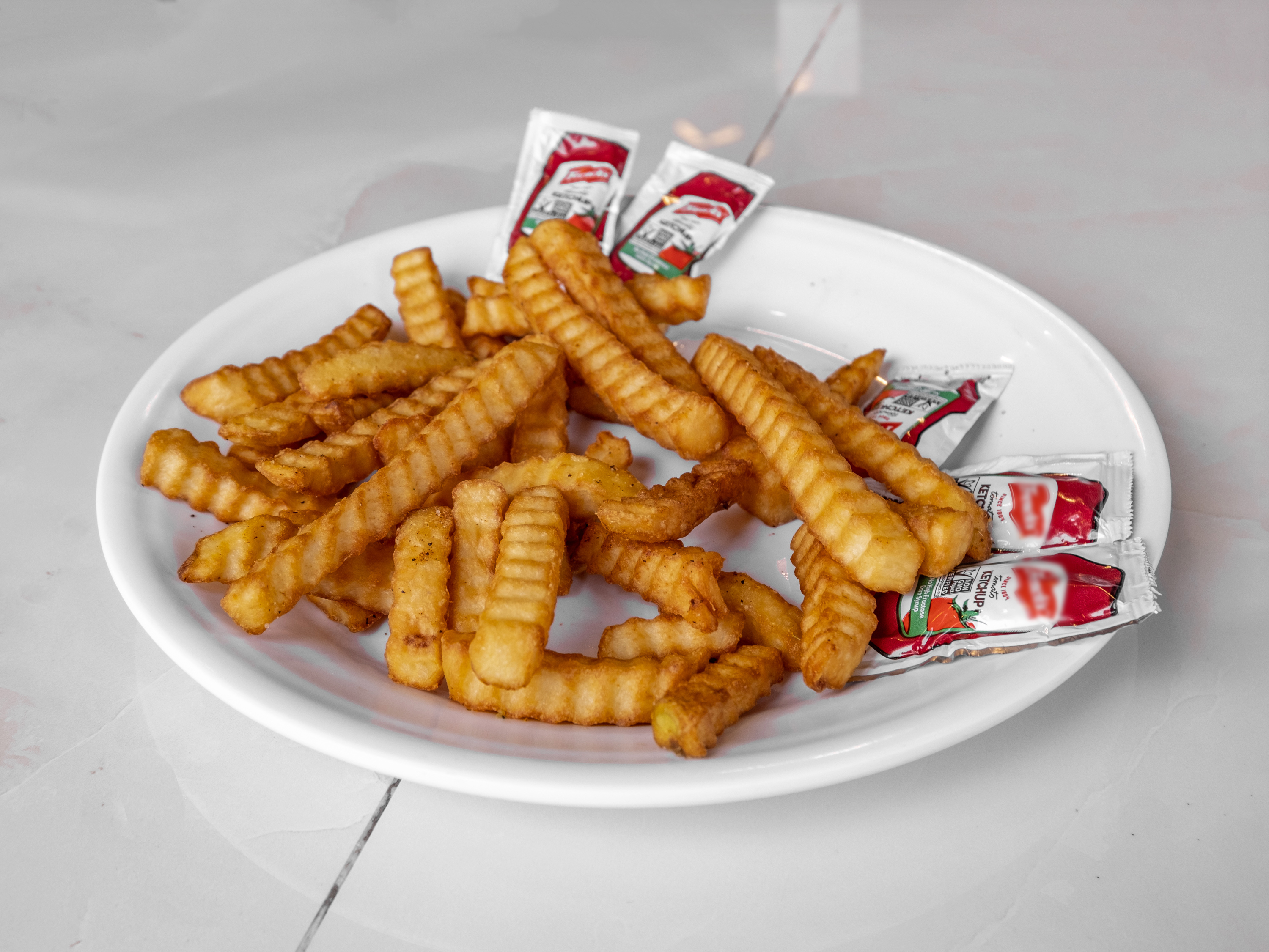 Order French Fries food online from New Yorker Pizza store, Leesburg on bringmethat.com