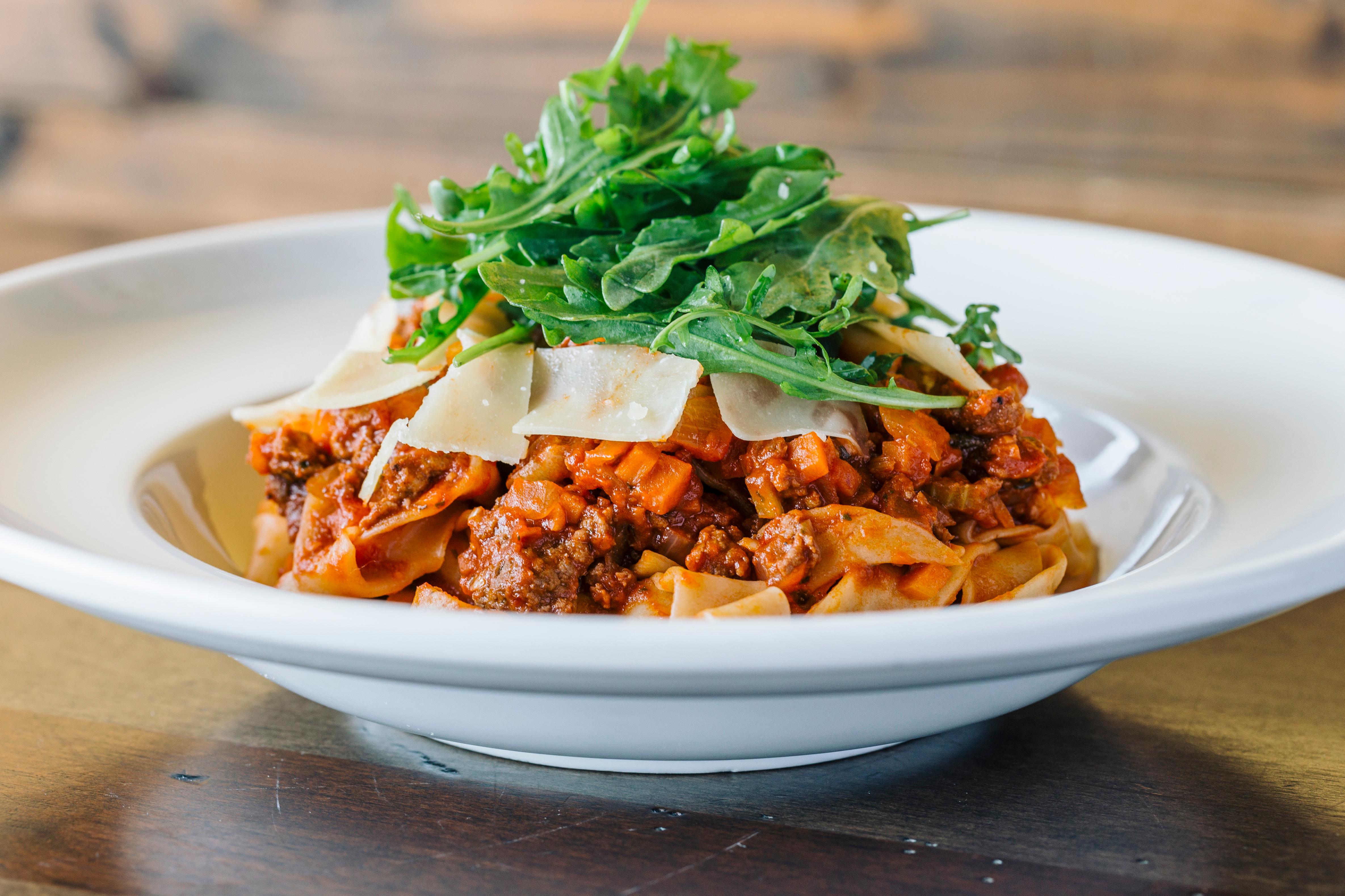 Order House Merguez Lamb Sausage Bolognese food online from Nirvana Wine & Grillerie store, Vernon Hills on bringmethat.com