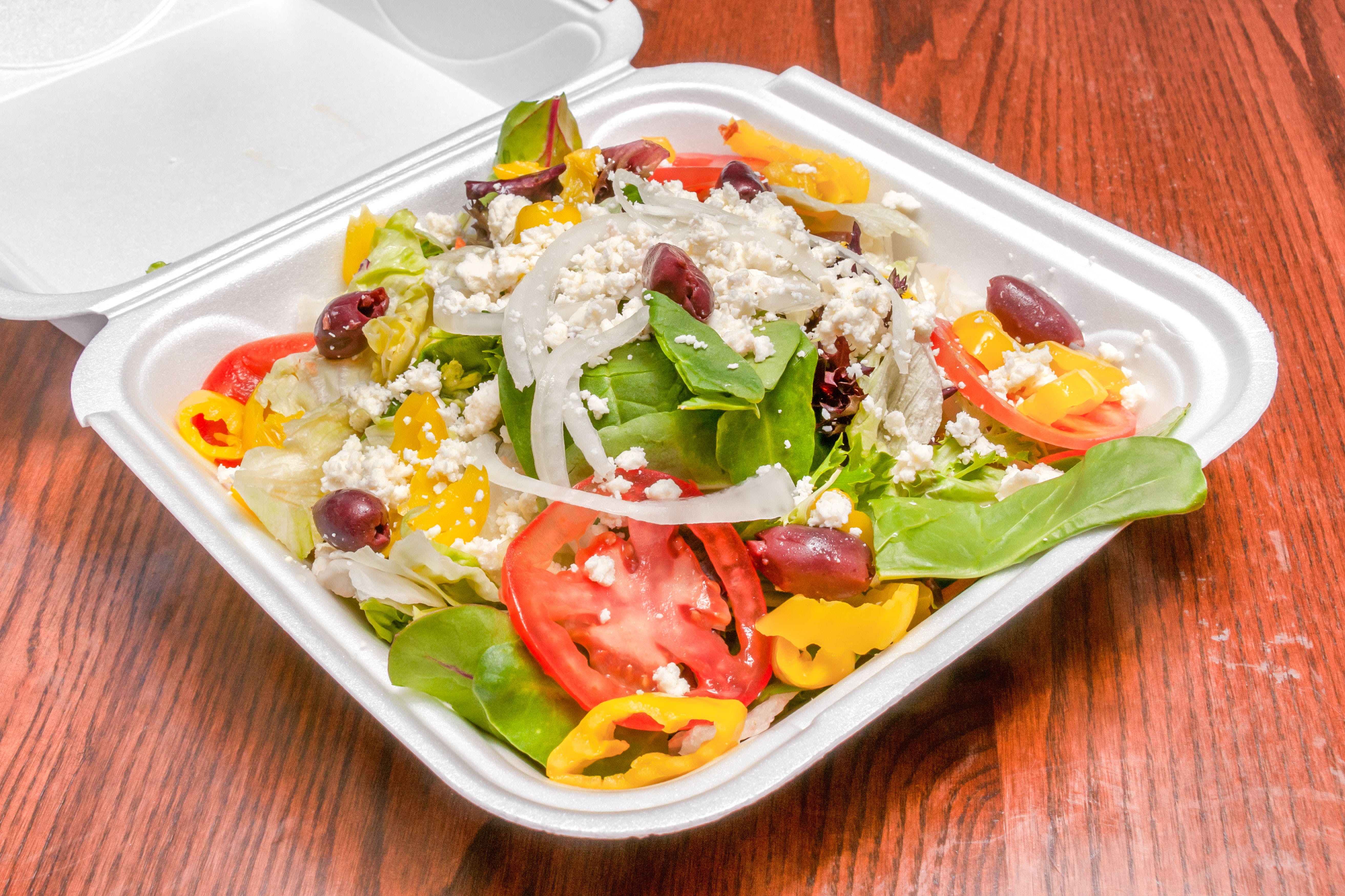 Order Greek Salad - Salad food online from Primo Pizza Ny Style store, Cary on bringmethat.com