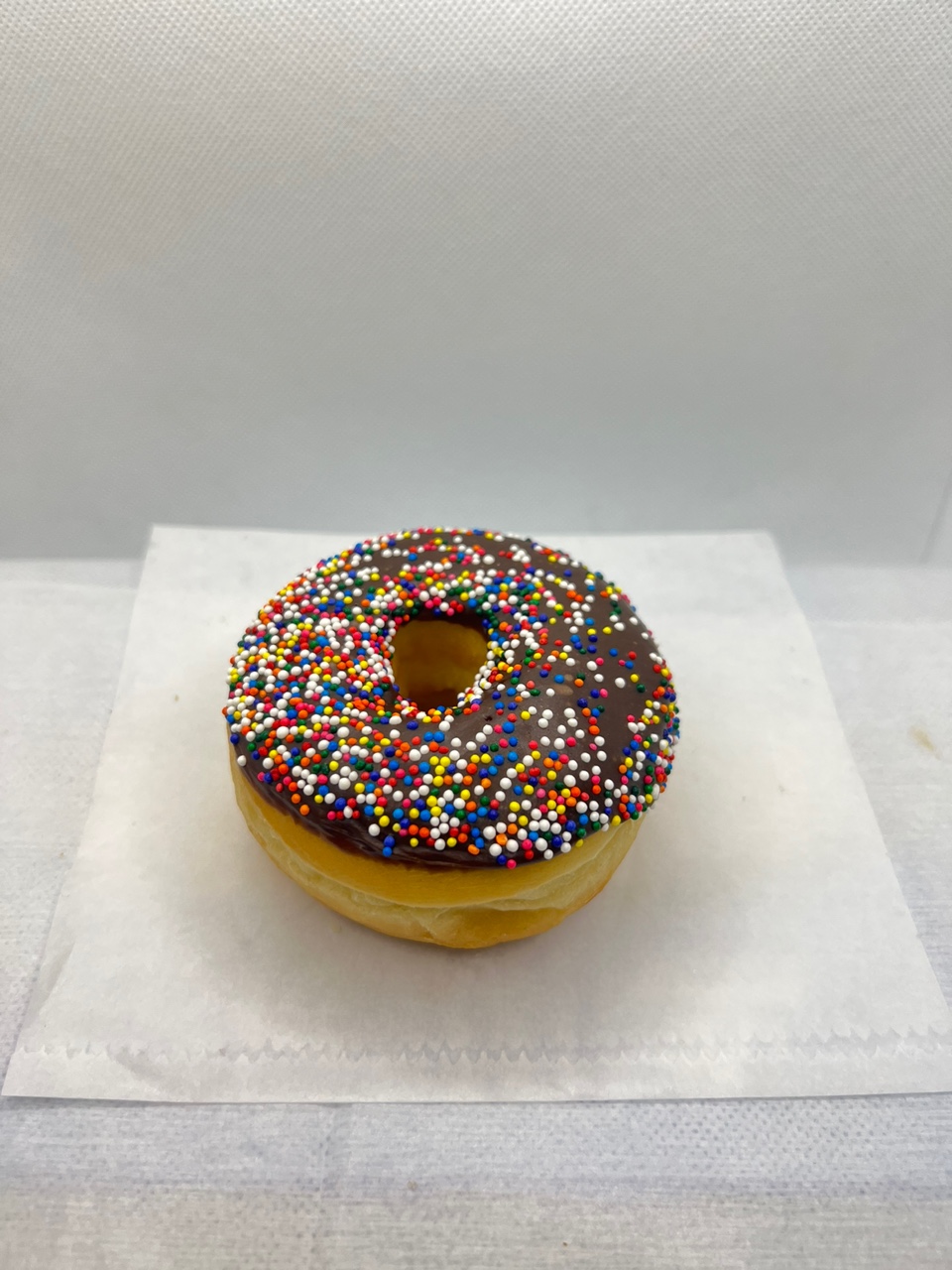 Order Chocolate sprinkle donut food online from Fresh & Creamy Donuts store, Lewisville on bringmethat.com