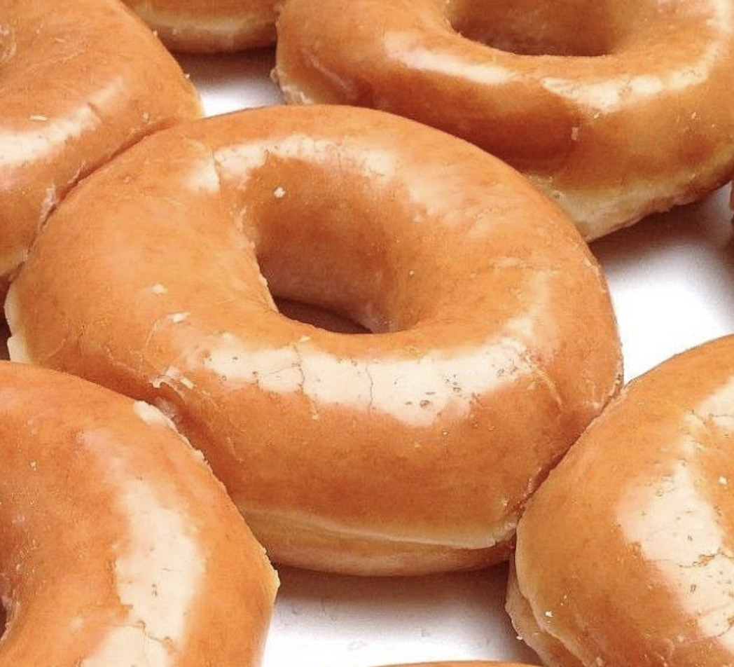 Order Raised (yeast) donut glazed or choc glazed food online from Donut Palace store, Dallas on bringmethat.com