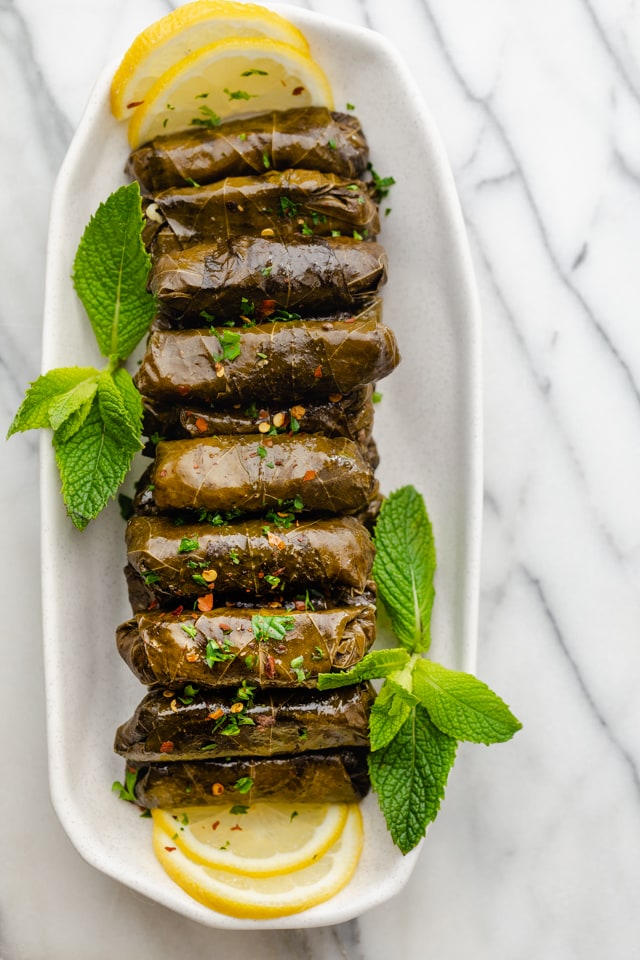 Order Stuffed grape leaves with rice and meat Dawali Dolma (NEW ITEM) food online from Salam store, Chicago on bringmethat.com