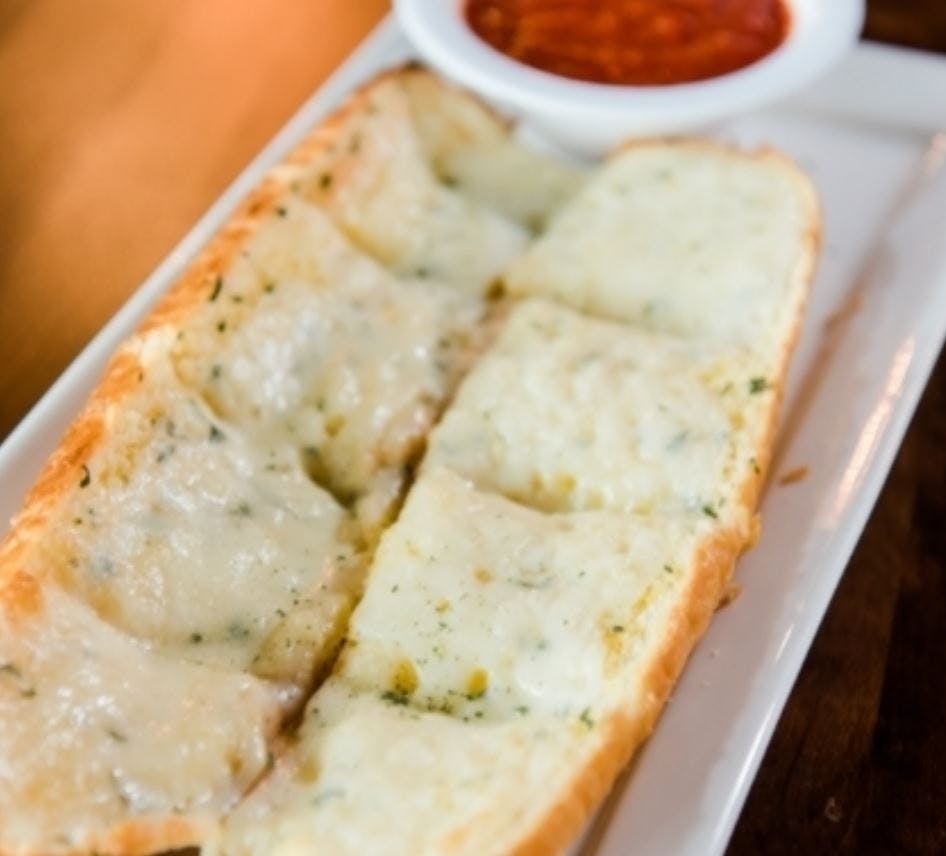 Order Garlic Bread with Cheese - No Cheese food online from Jonny Pizza store, Fort Worth on bringmethat.com