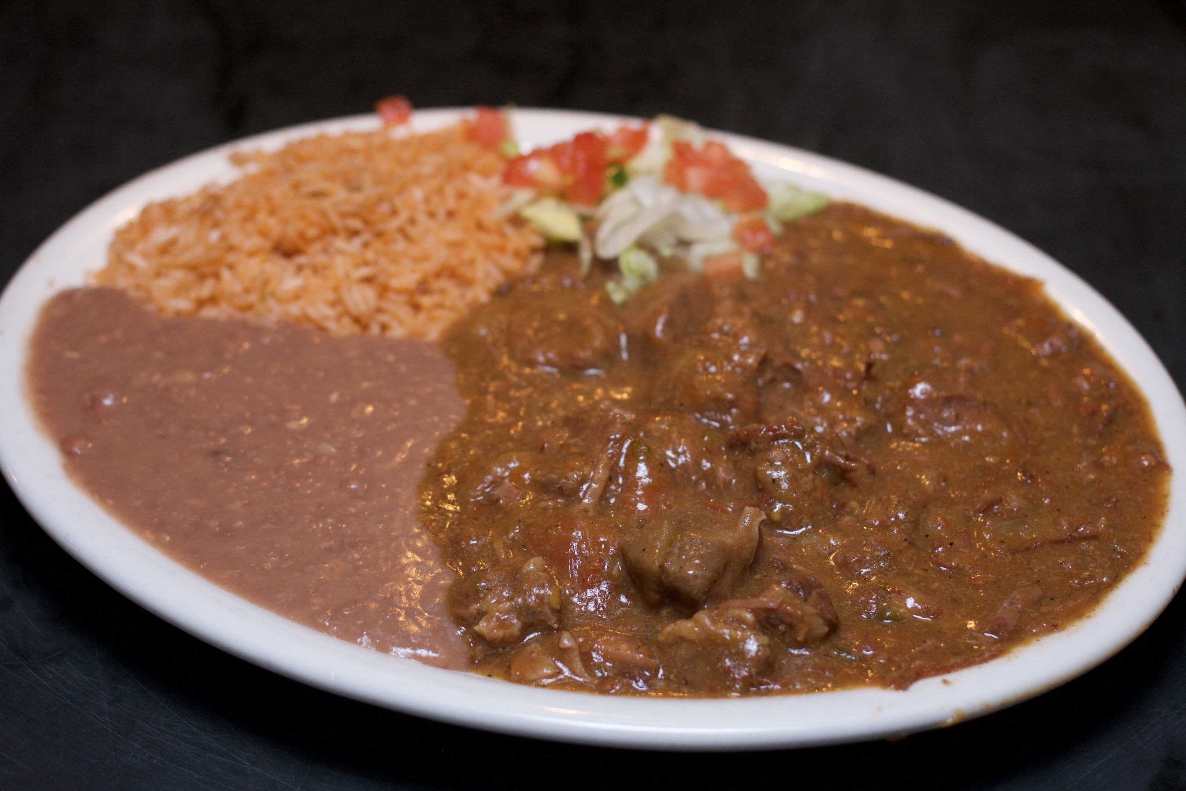 Order Carne Guisada Dinner food online from Alamo Cafe store, San Antonio on bringmethat.com