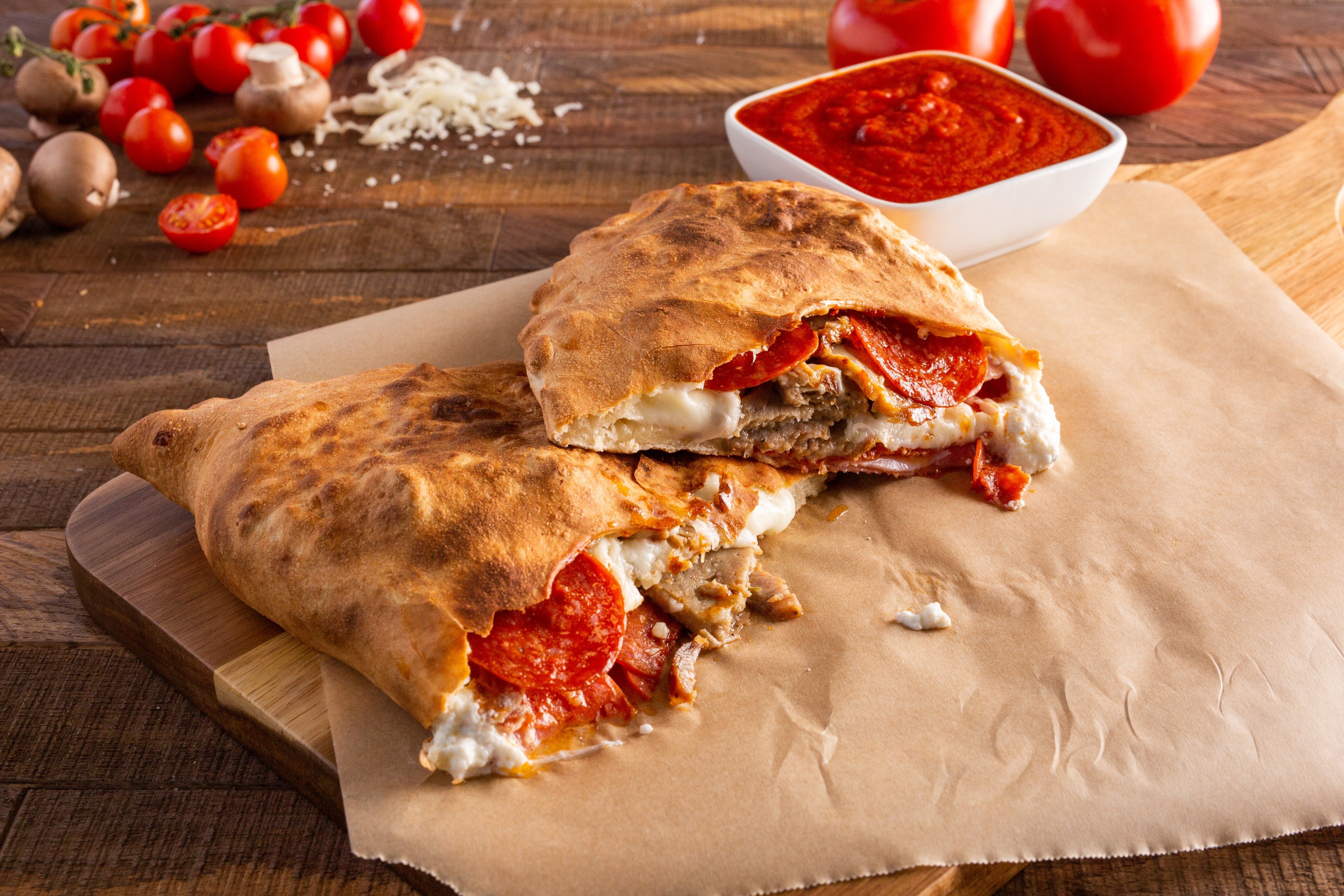Order Meat Lover's Calzone - Calzone food online from Ameci Pizza & Pasta store, Glendale on bringmethat.com