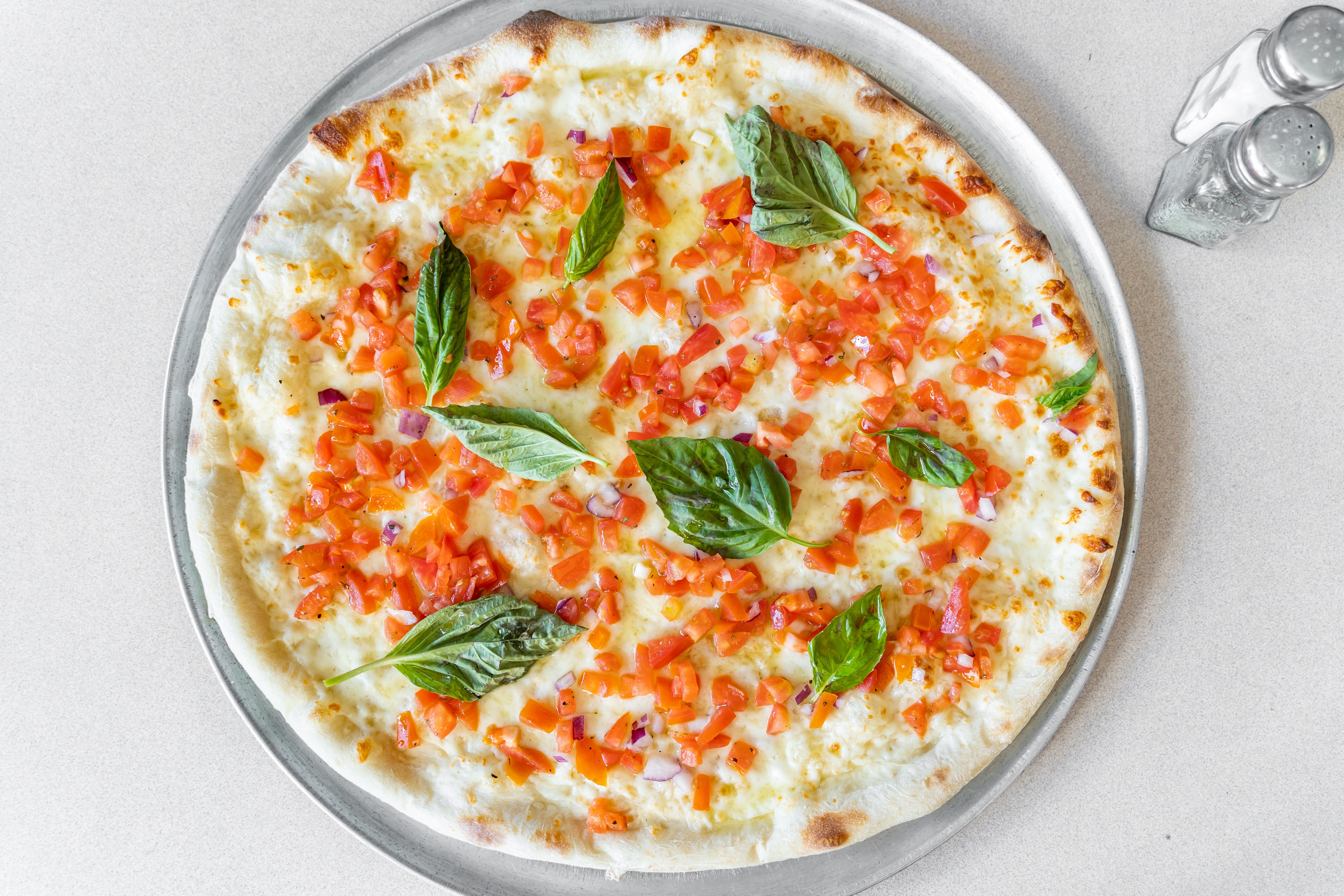 Order Bruschetta White Pizza - Personal 10" food online from Capri Pizza store, Sicklerville on bringmethat.com