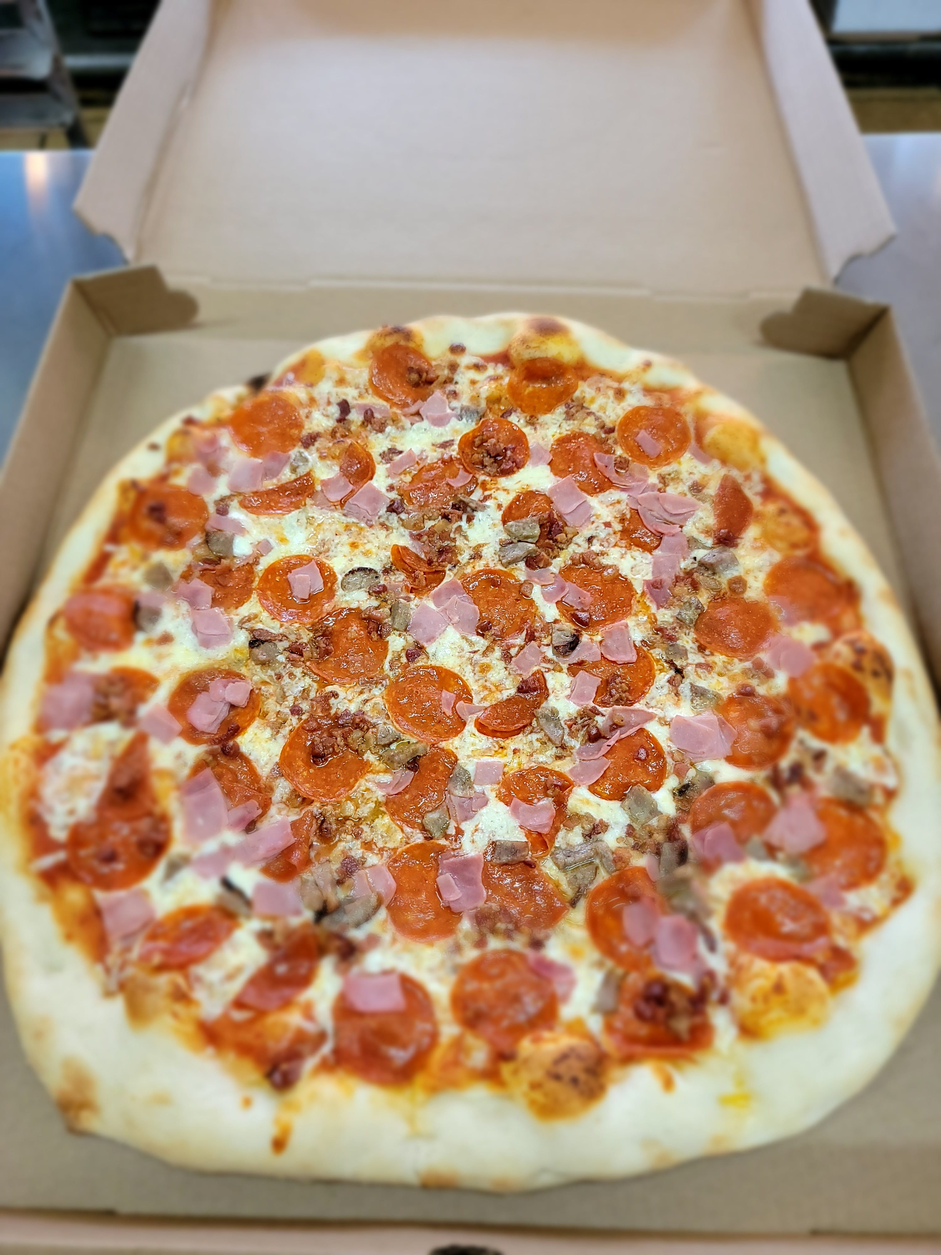Order Meatlovers Pizza - Medium 16'' food online from Tony Pizza store, Highspire on bringmethat.com