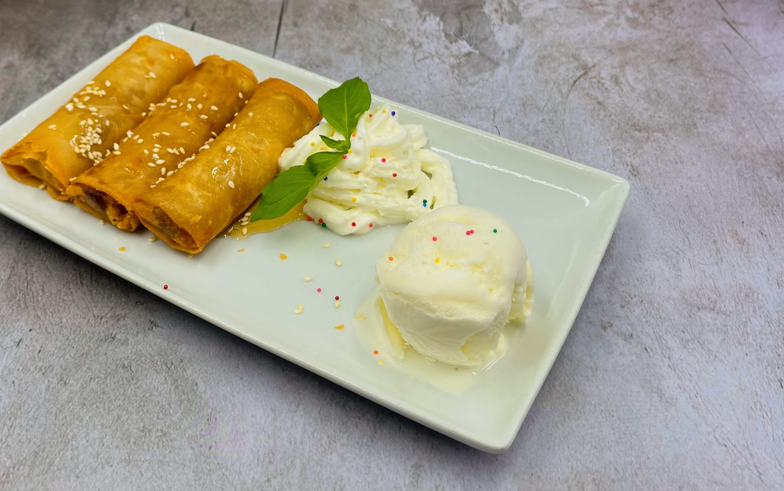 Order FRIED BANANA WITH ICE CREAM food online from Thai Diva Cuisine store, Woodside on bringmethat.com