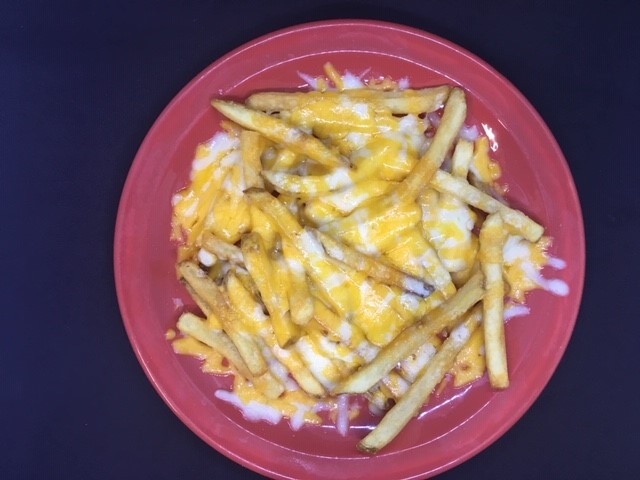Order Cheese Fries food online from Poco Mexican/American Restaurant, Bar & Comedy Cabaret store, Doylestown on bringmethat.com
