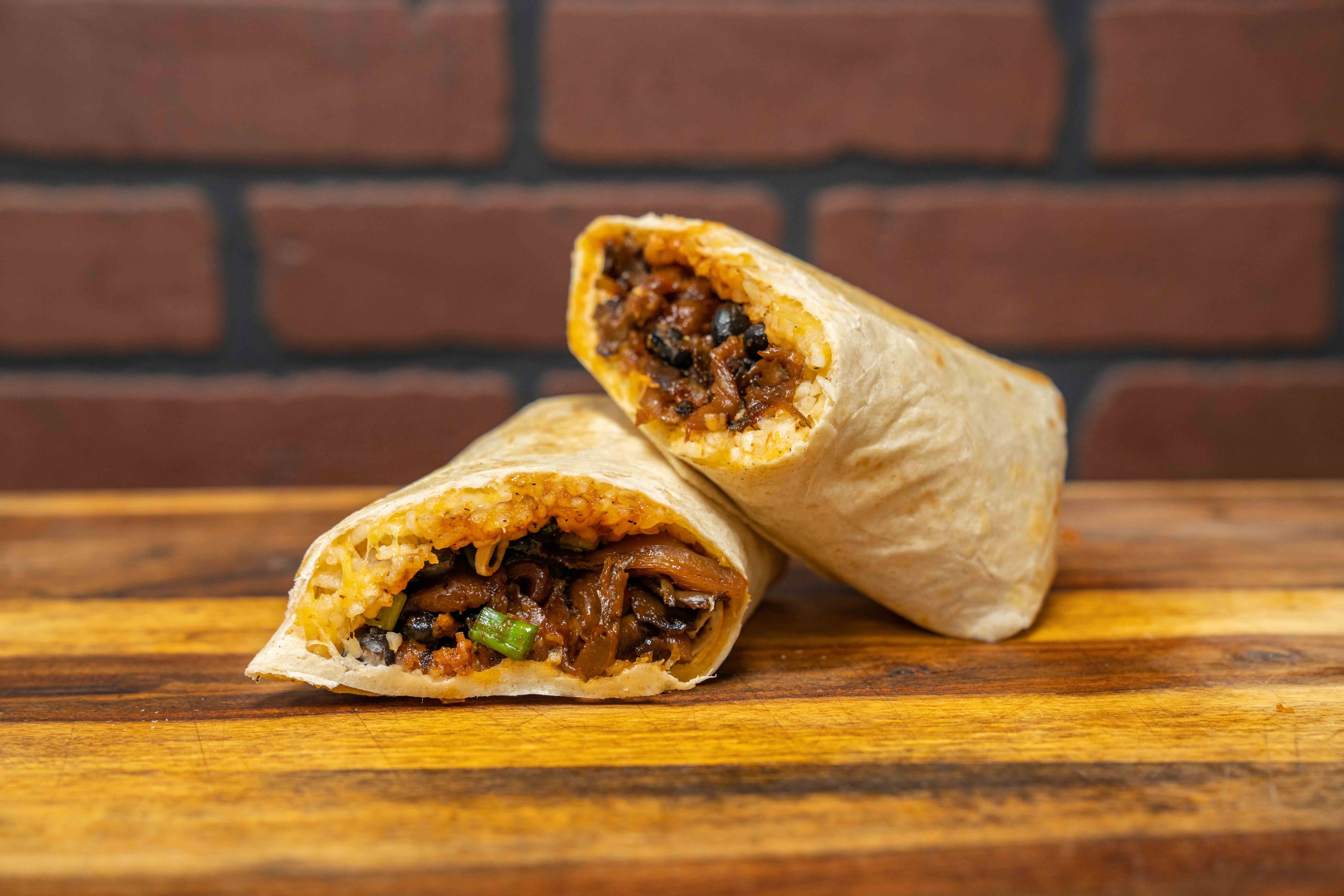 Order The Edgy Veggie Burrito food online from Big Belly Que store, Smithtown on bringmethat.com