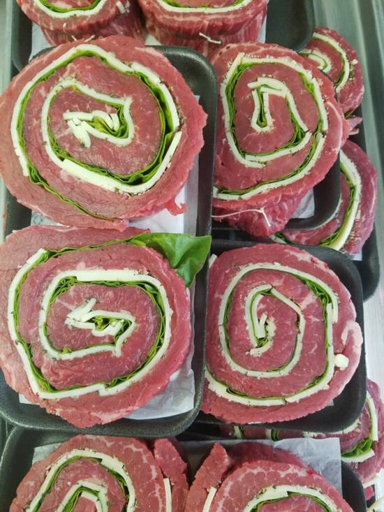 Order Beef Pinwheel Steaks (1 pc) food online from Cow Palace Butcher Shop store, Middle Island on bringmethat.com