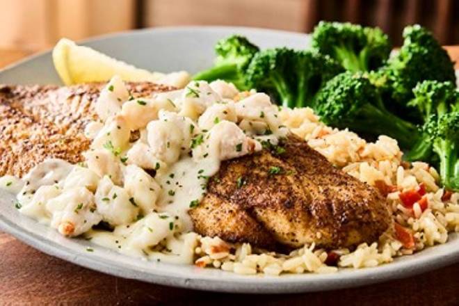 Order NEW! Crab-Topped Barramundi* food online from Outback Steakhouse store, Charlotte on bringmethat.com