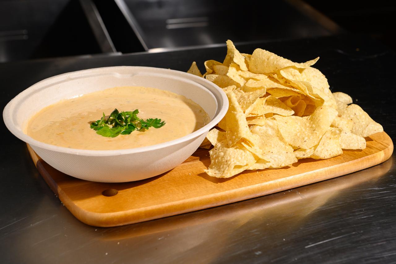 Order Chips & Queso food online from Atx Sliders At Ghostline Kitchen store, Austin on bringmethat.com