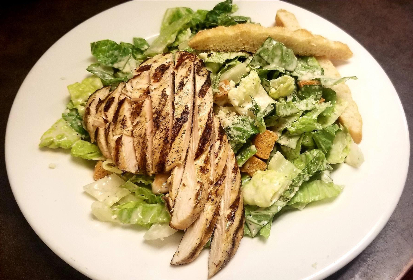 Order Grilled Chicken Caesar Salad  food online from Your Mothers Bar store, Mount Clemens on bringmethat.com