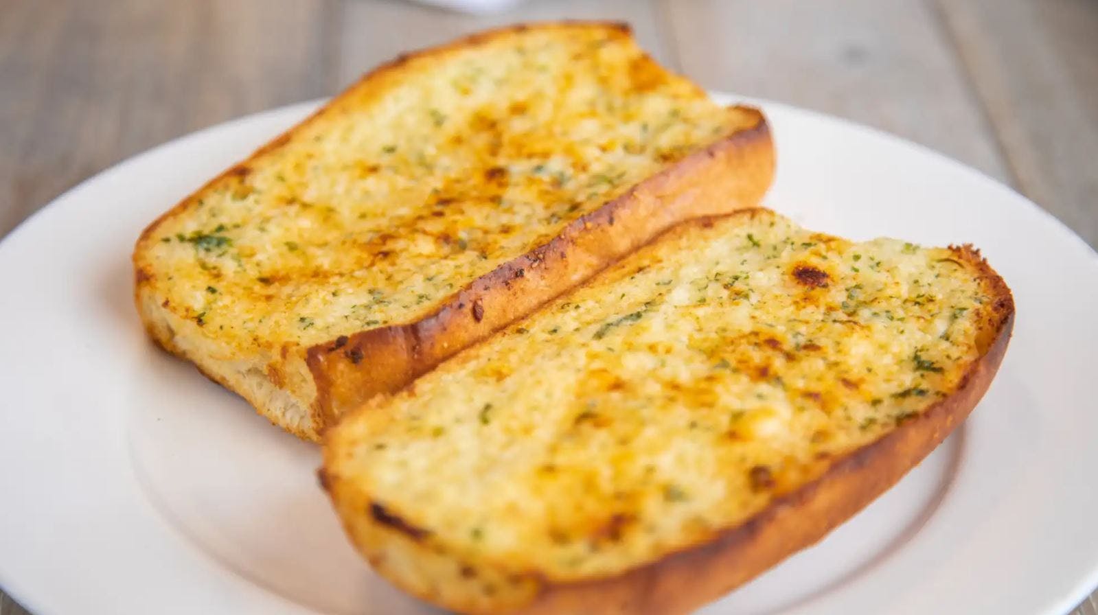 Order Garlic Bread - Appetizer food online from Bambino's Restaurant store, Concord on bringmethat.com