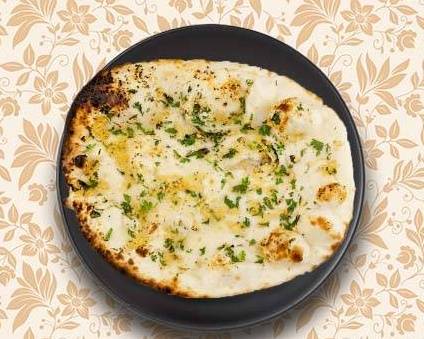 Order Garlic Flavoured Naan food online from Greens and Grains store, Chantilly on bringmethat.com