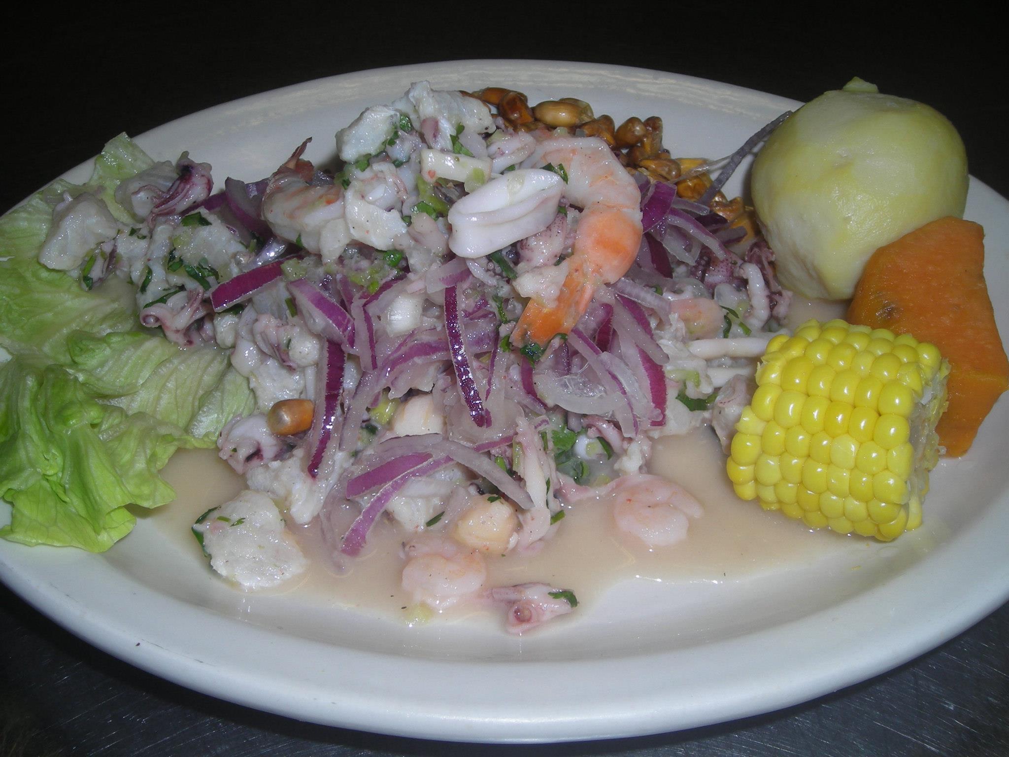 Order 25. Ceviche Mixto food online from Mily & Lalo Peruvian Restaurant store, Charlotte on bringmethat.com