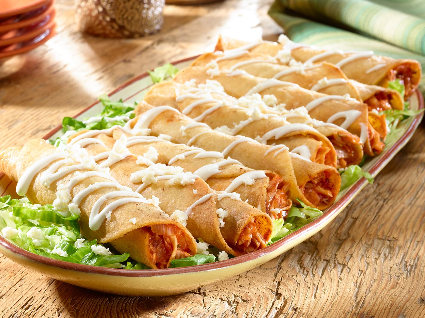Order 19. Four Rolled Taquitos food online from Abelardo store, Omaha on bringmethat.com