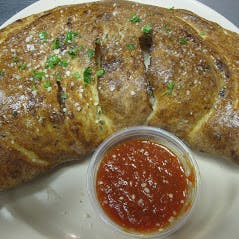Order Calzone - Calzone food online from Pizza Parlor store, Pearland on bringmethat.com