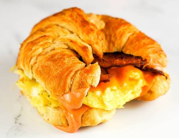 Order Bacon, Egg and Cheddar Croissant Sandwich food online from The Breakfast Club and Barrista Bar store, Scottsdale on bringmethat.com