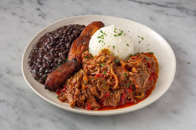 Order Plato de Ropa Vieja (Cuban-Style Stewed Beef) food online from Porto's Bakery & Cafe store, Downey on bringmethat.com