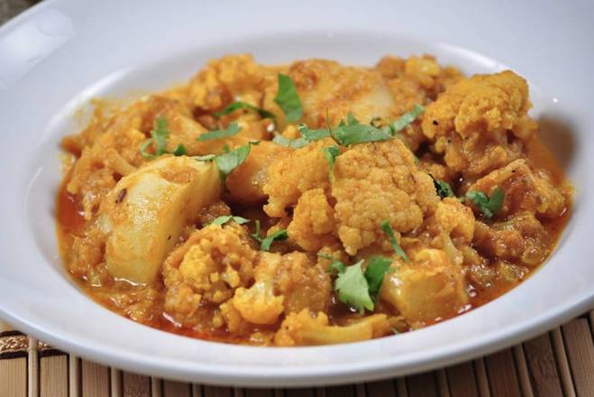 Order Aloo Ghobi  (with Basmati Rice or Naan) food online from House of curries store, Berkeley on bringmethat.com