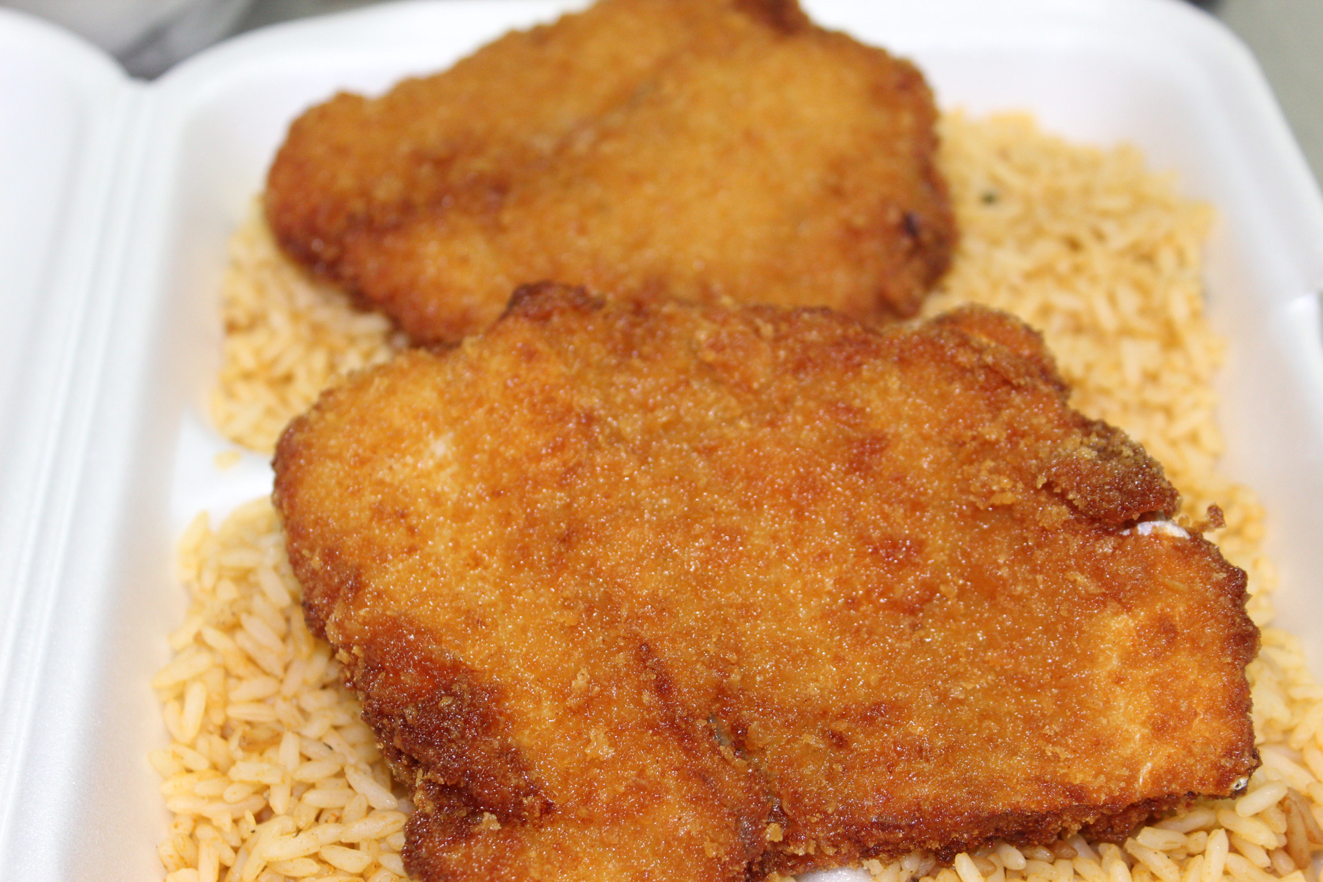 Order A13. Fried Fish with Mexican Rice food online from Yummy Taco store, Inwood on bringmethat.com