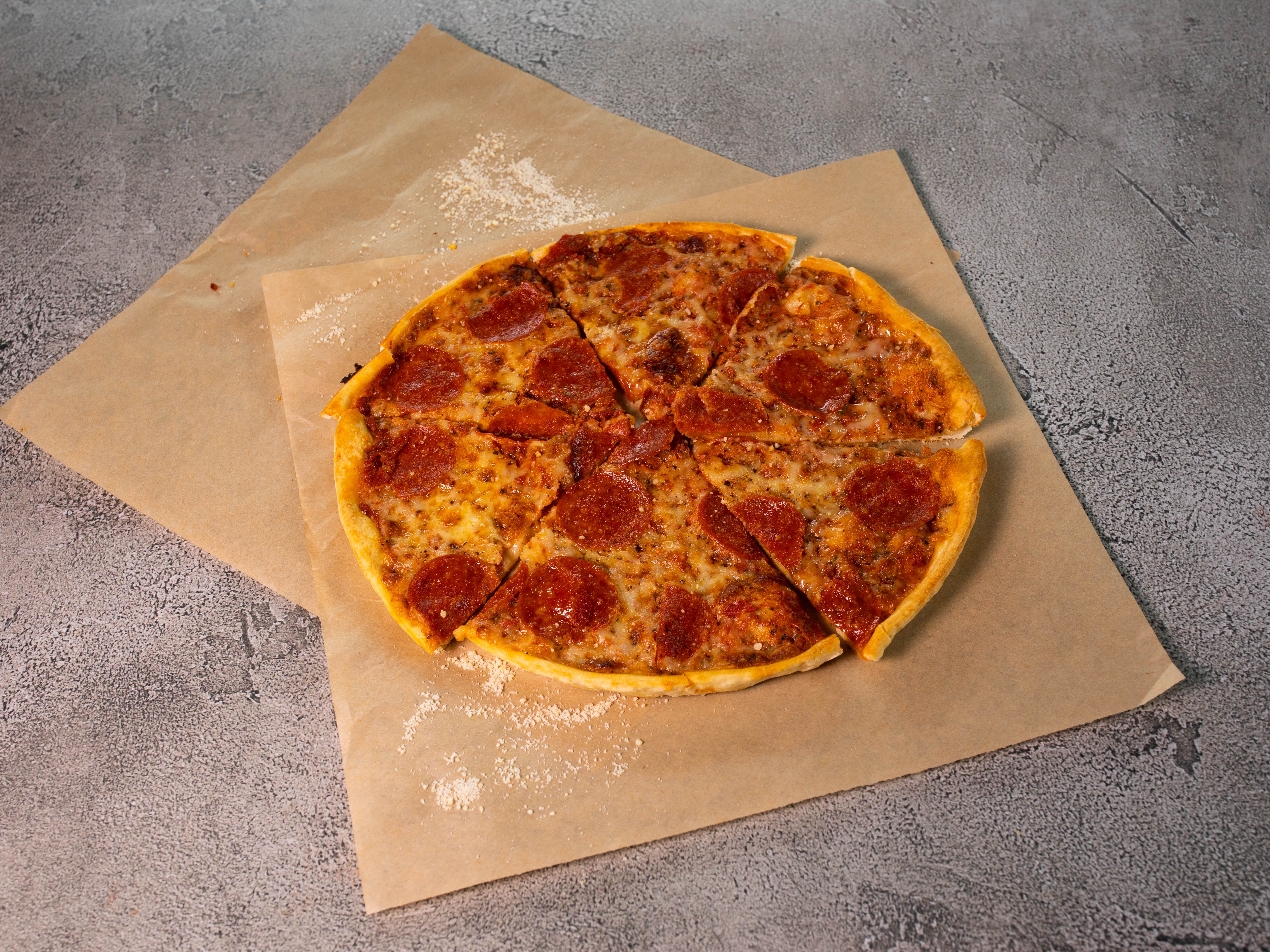 Order 1 Topping Original Thin Crust Pizza food online from Smitty Pizza store, Shreveport on bringmethat.com