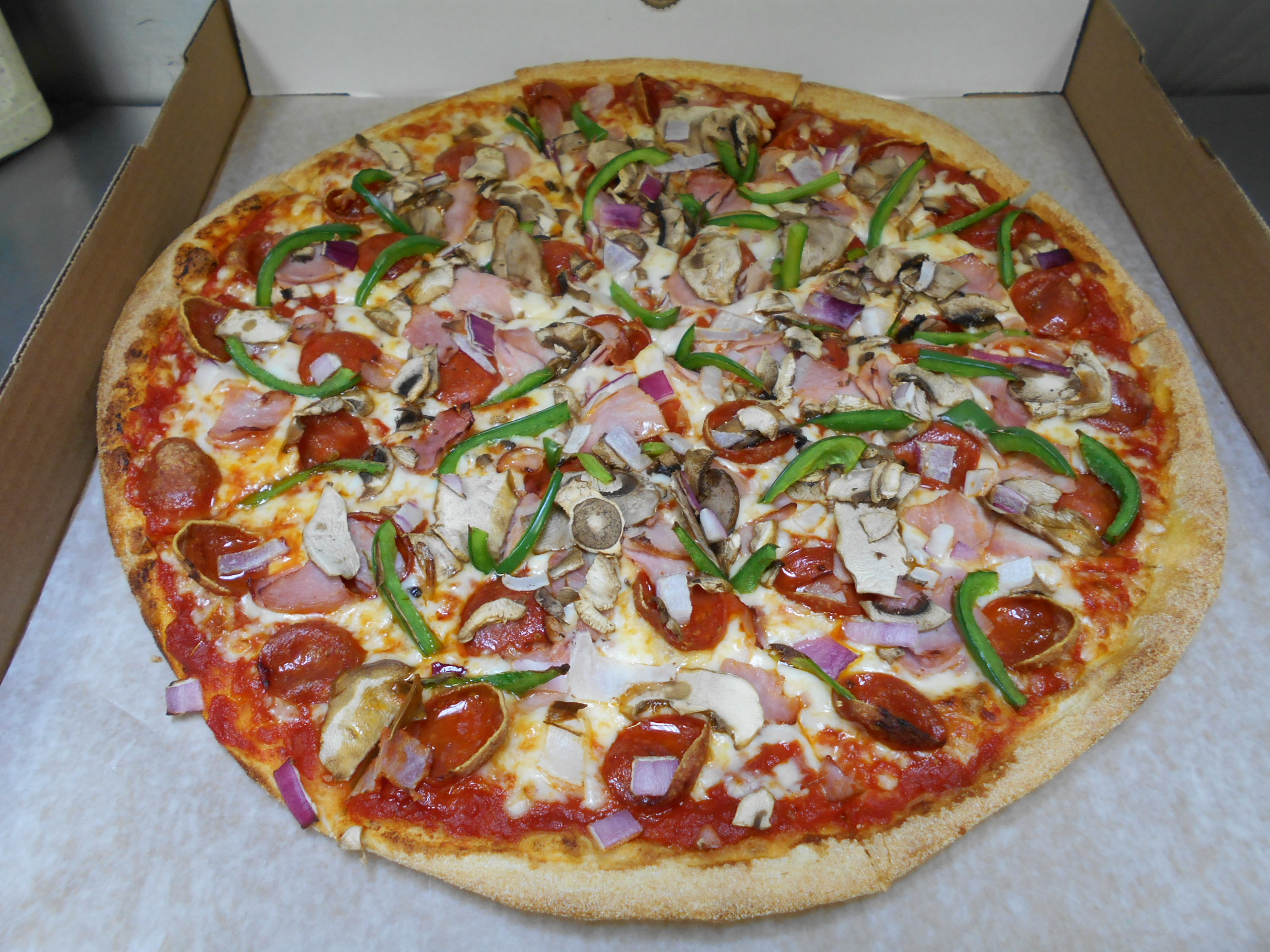 Order Deluxe Specialty Pizza food online from Mama Mary Pizza store, Holland on bringmethat.com